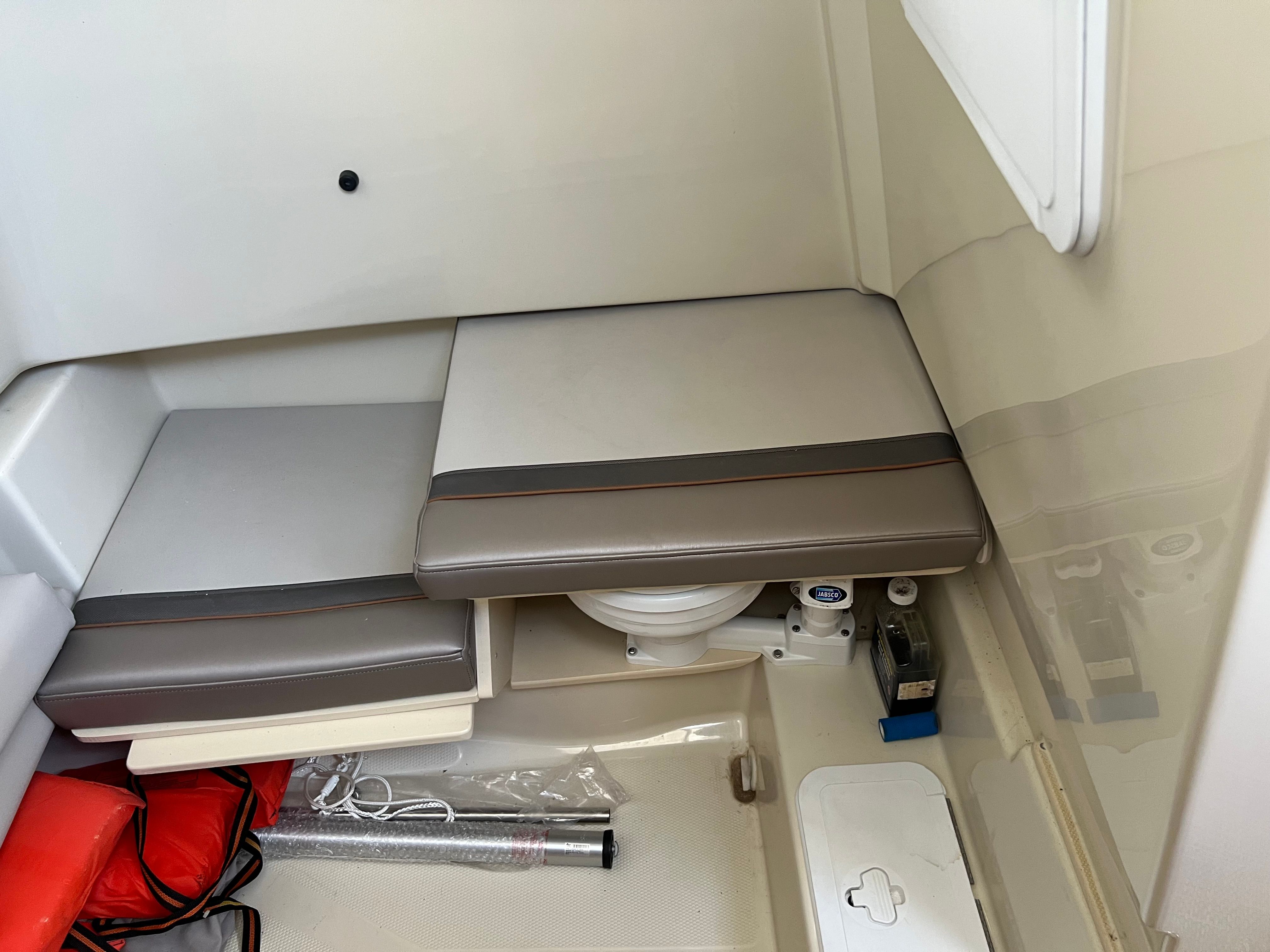 Interior of a 2022 Cutwater C-24 CW with seating cushions and storage space.