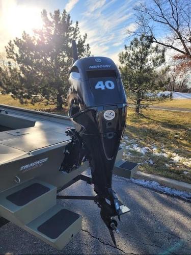 2025 Tracker Grizzly 1654 T Sportsman boat with Mercury 40 outboard motor in scenic setting.