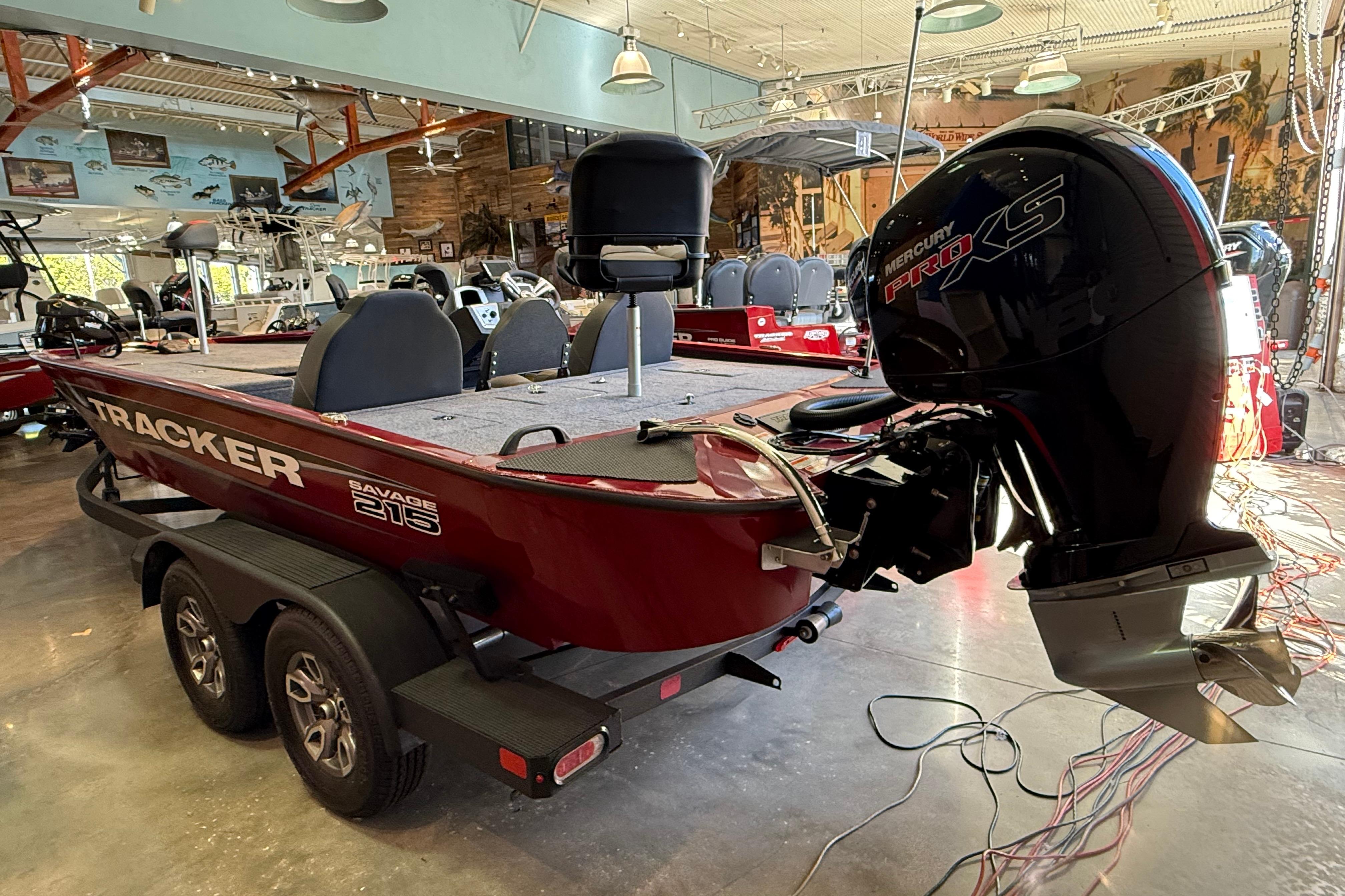 2025 Tracker Savage 215 boat with Mercury Pro XS engine in showroom.