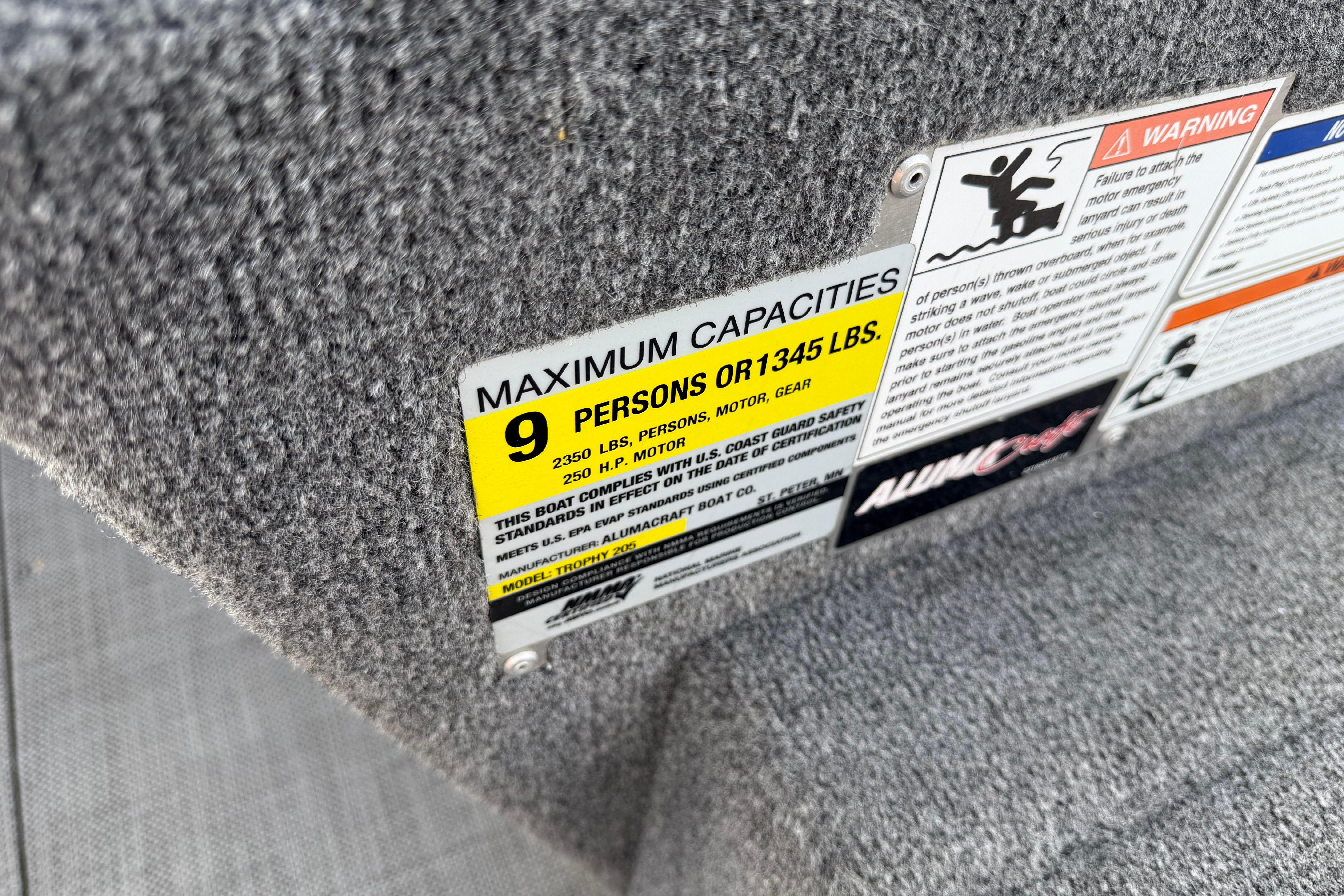 2019 Alumacraft Trophy 205 capacity label, maximum 9 persons or 1345 lbs.