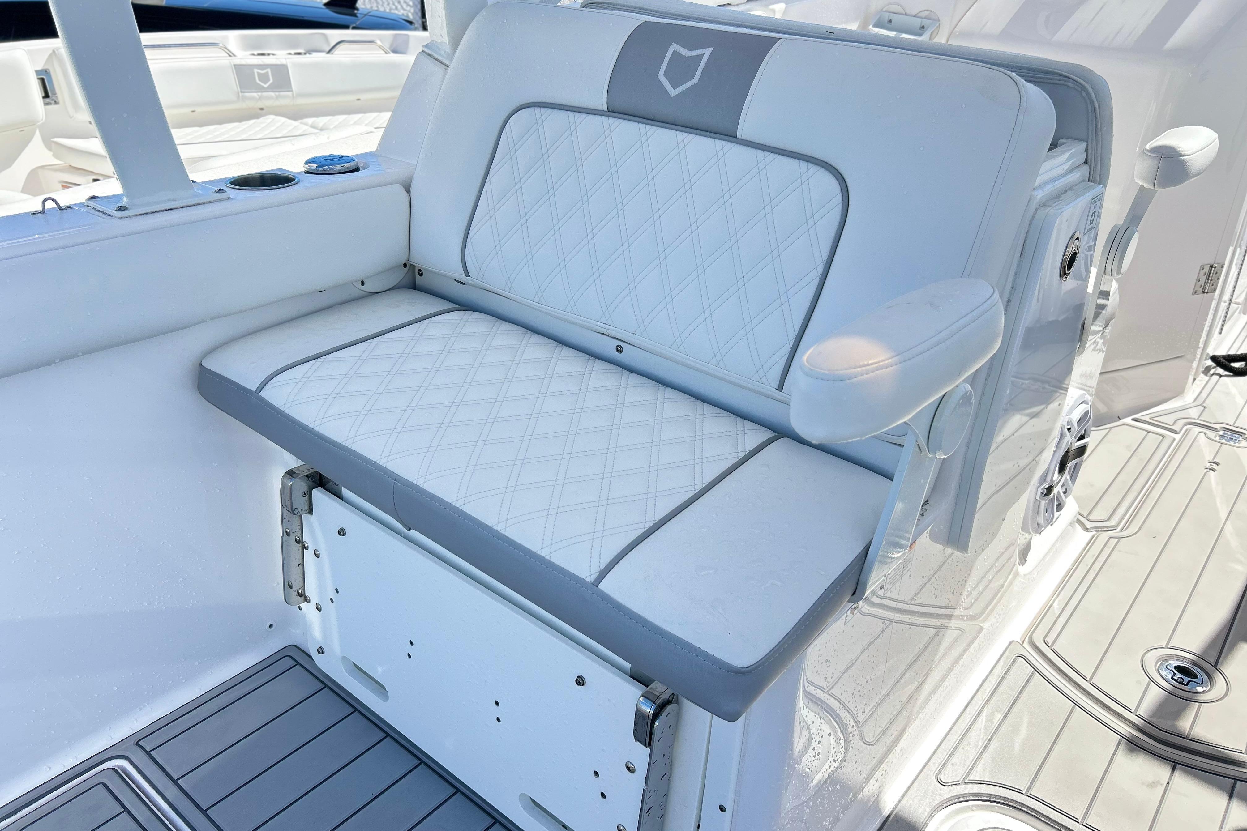 2025 Sea Fox 288 Traveler boat seat with diamond-pattern upholstery and armrest.
