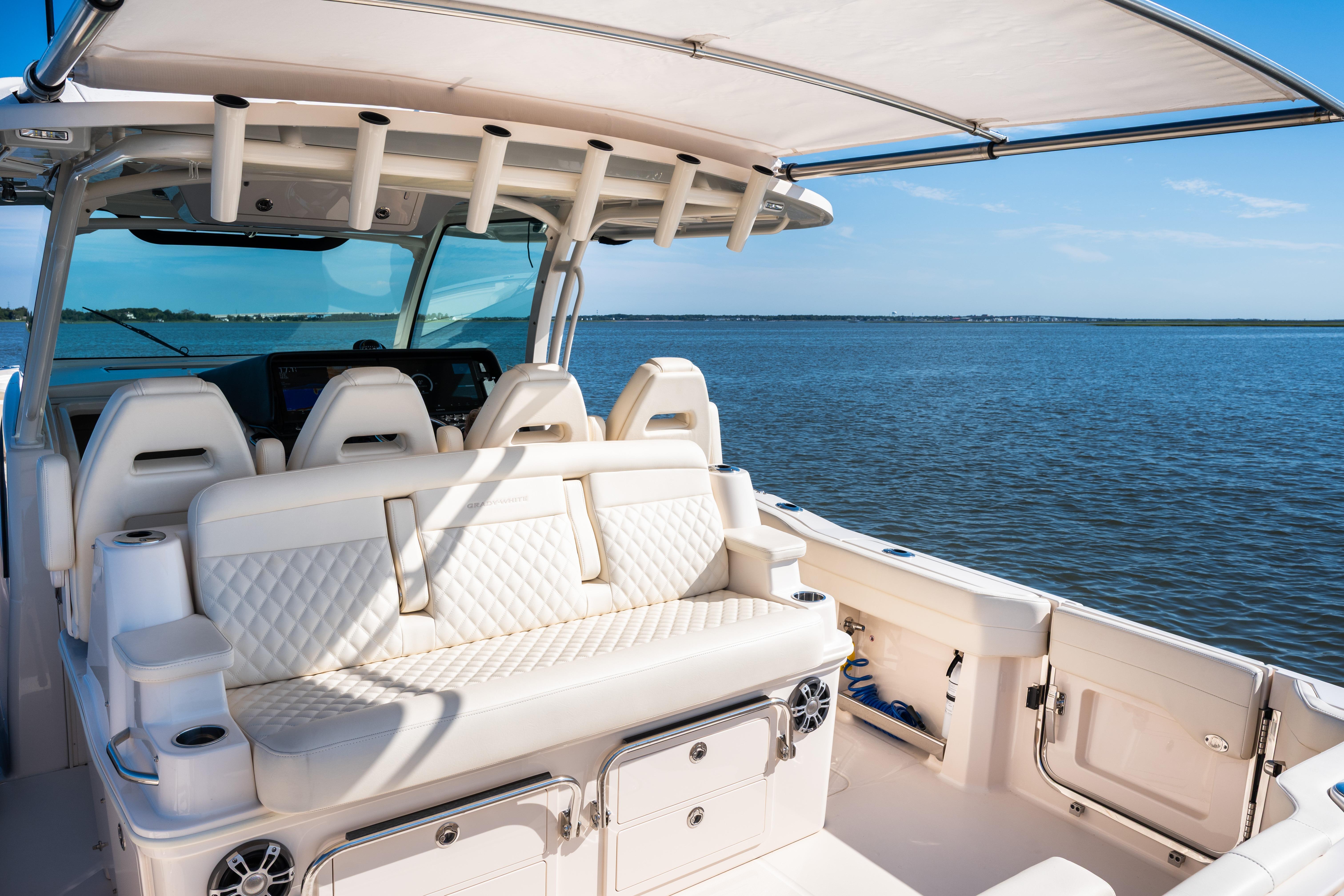 2025 Grady-White Canyon 386 boat interior with luxurious seating on open water.