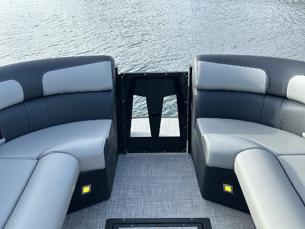 2025 Montara Surf Boss 2.0 25 boat interior with sleek seating on water.