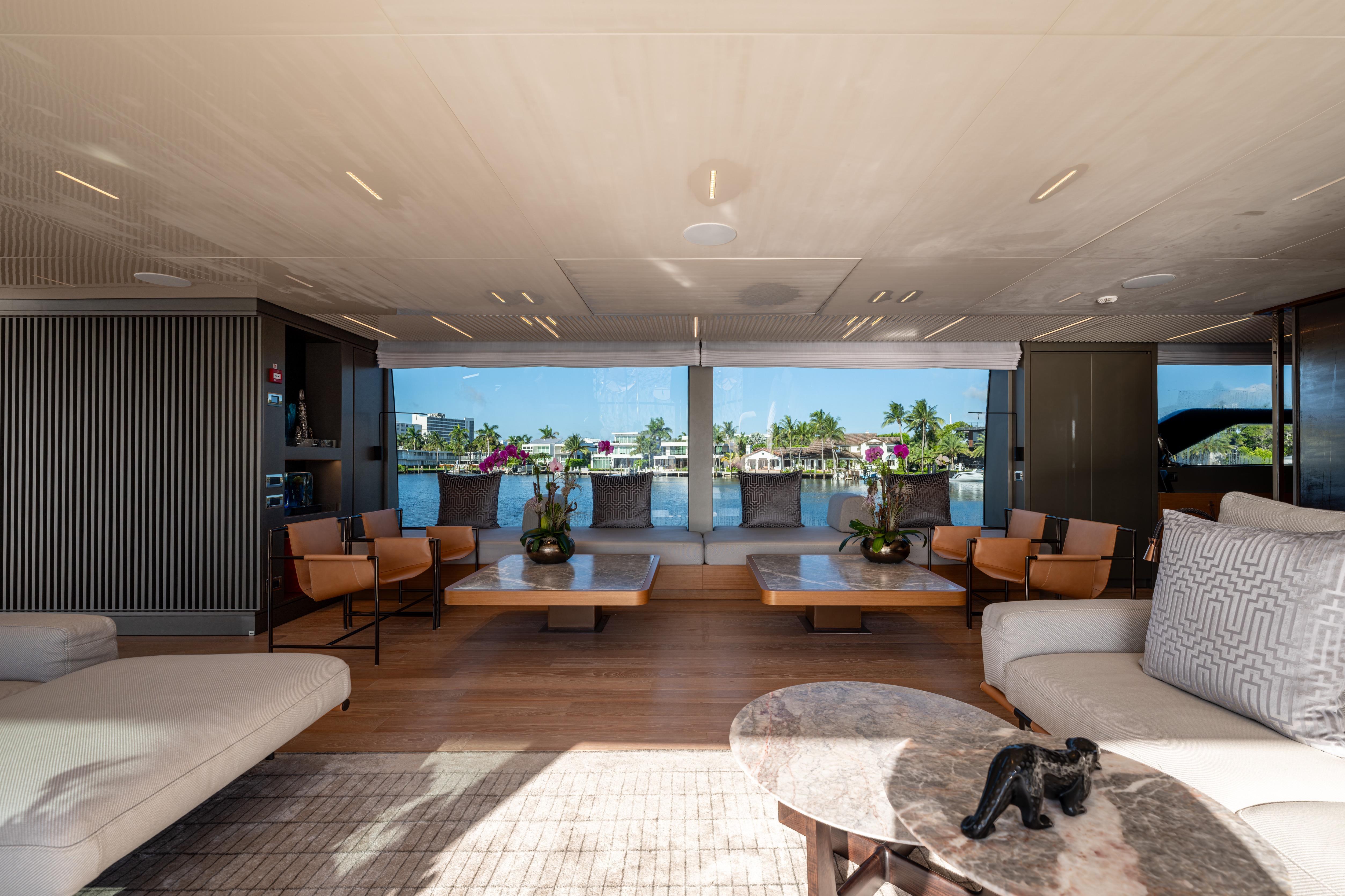 Luxurious interior of 2023 Sanlorenzo SL120A yacht with elegant seating and scenic views.
