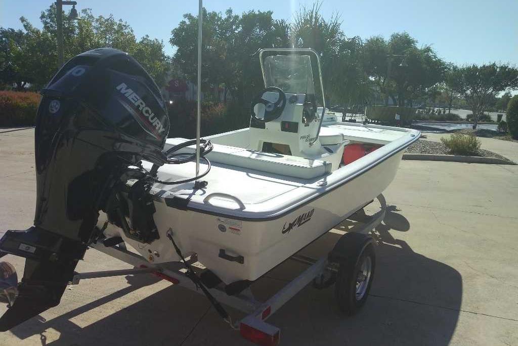 2026 Mako Pro Skiff 13 CC boat with Mercury engine on trailer.