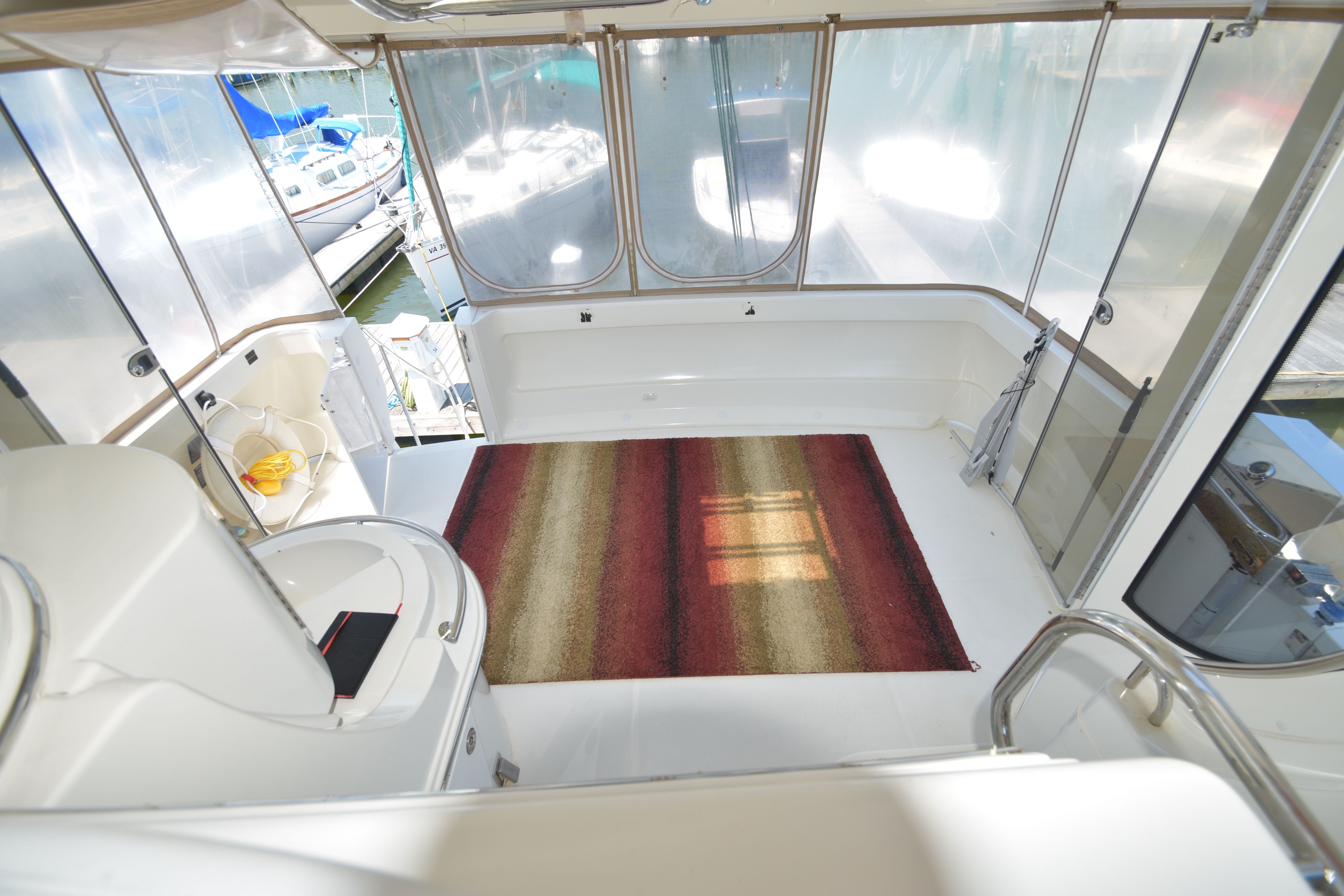 Interior of a 2004 Carver 466 Motor Yacht with a rug and seating area.