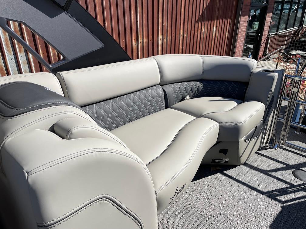 Luxurious seating on 2025 Barletta Lusso 25QSS pontoon boat, featuring elegant upholstery.