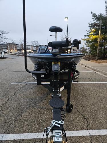 2025 Nitro Z21 XL boat on trailer in parking lot.