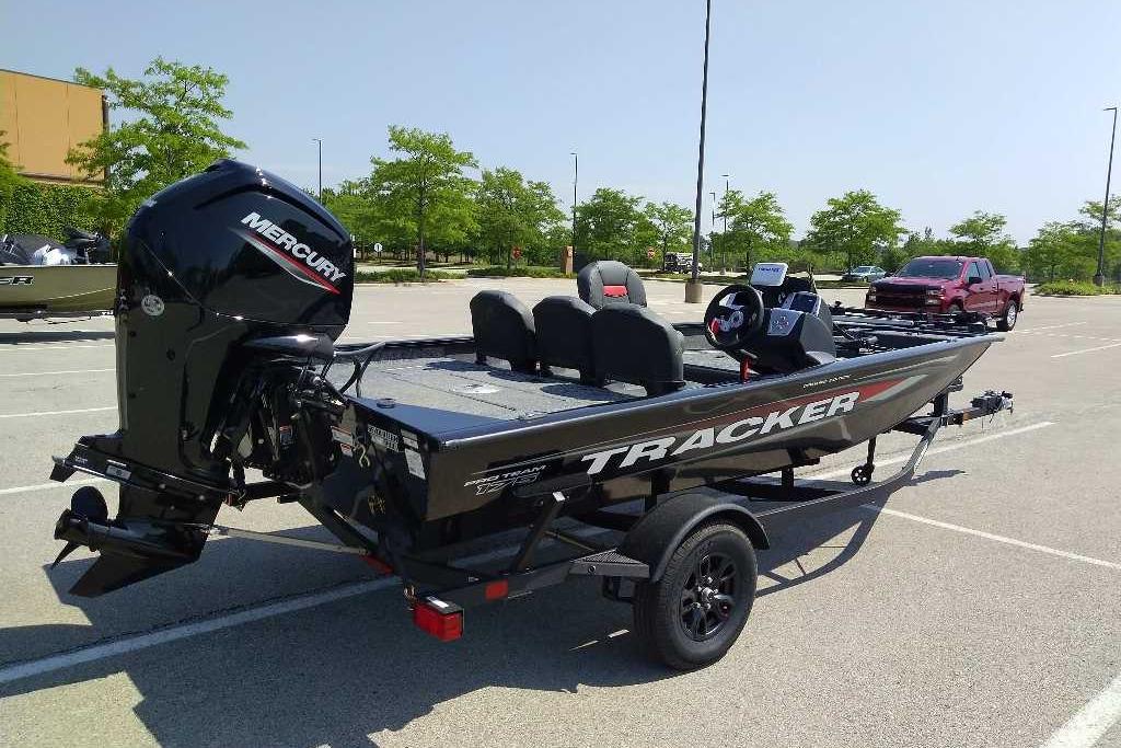 2026 Tracker Pro Team 175 Crappie Edition boat with Mercury engine in parking lot.