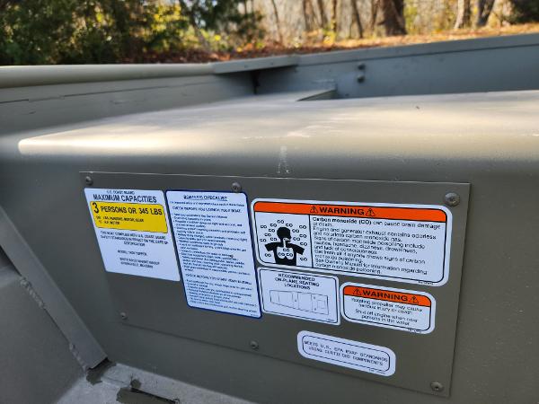2025 Tracker Grizzly 1436 Utility boat safety and capacity warning labels.