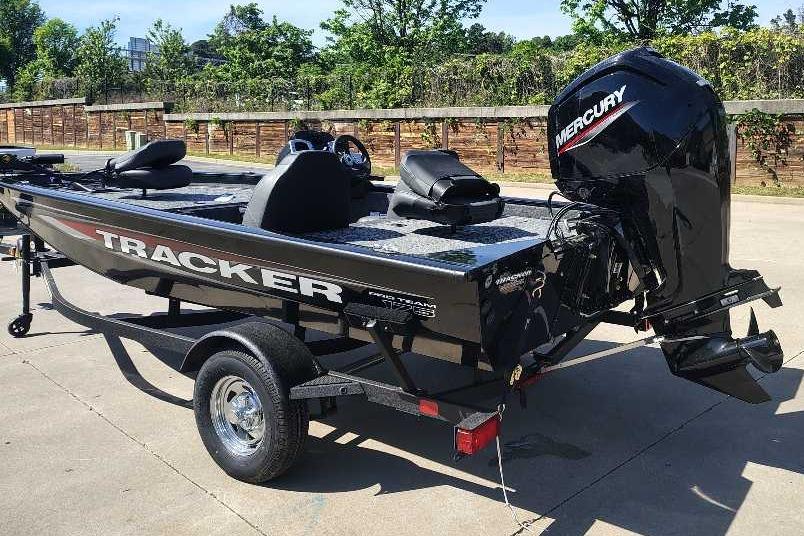 2026 Tracker Pro Team 175 boat with Mercury engine on trailer, parked outdoors.