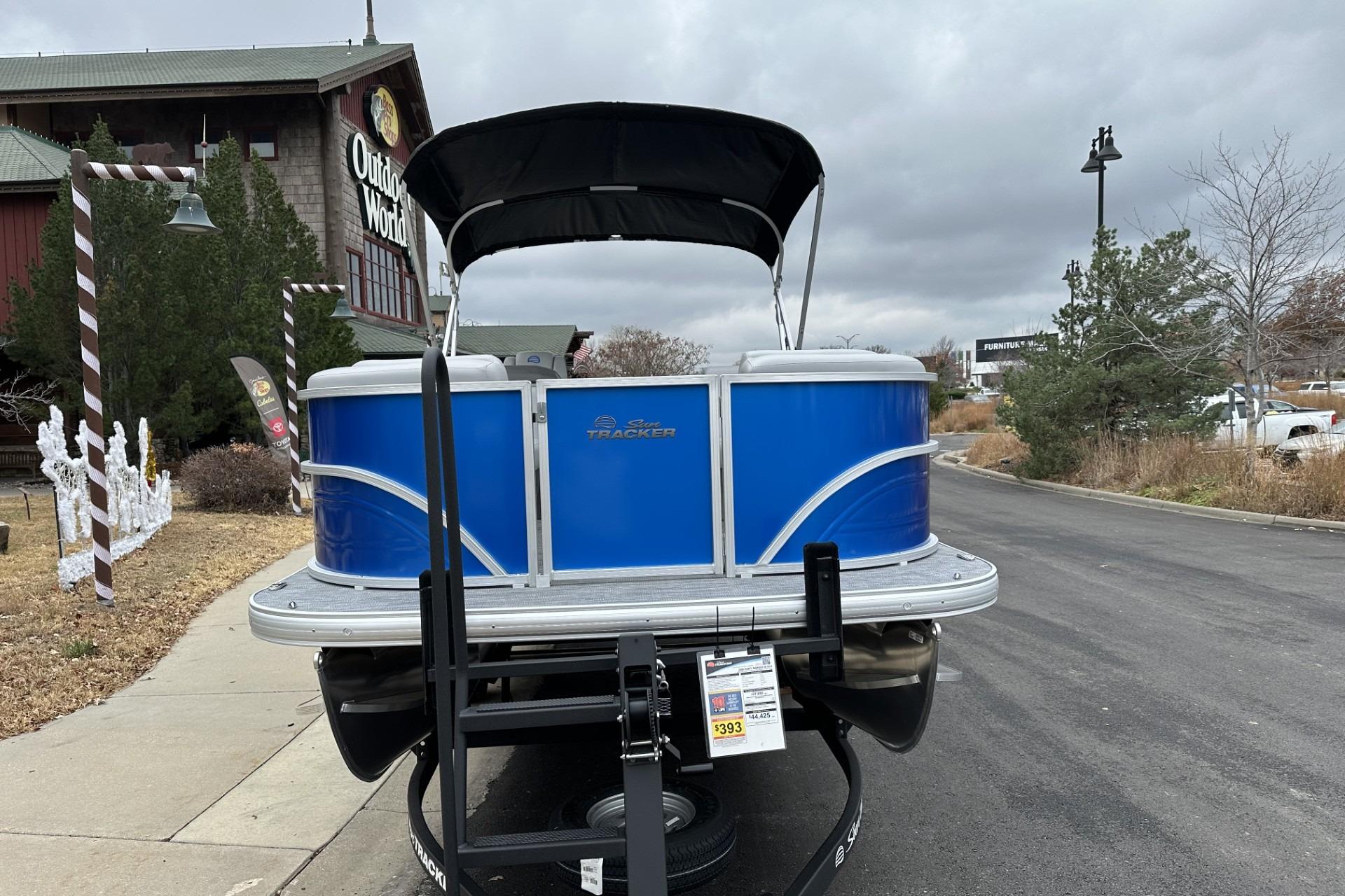 2026 Sun Tracker Party Barge 20 DLX pontoon boat displayed outdoors.