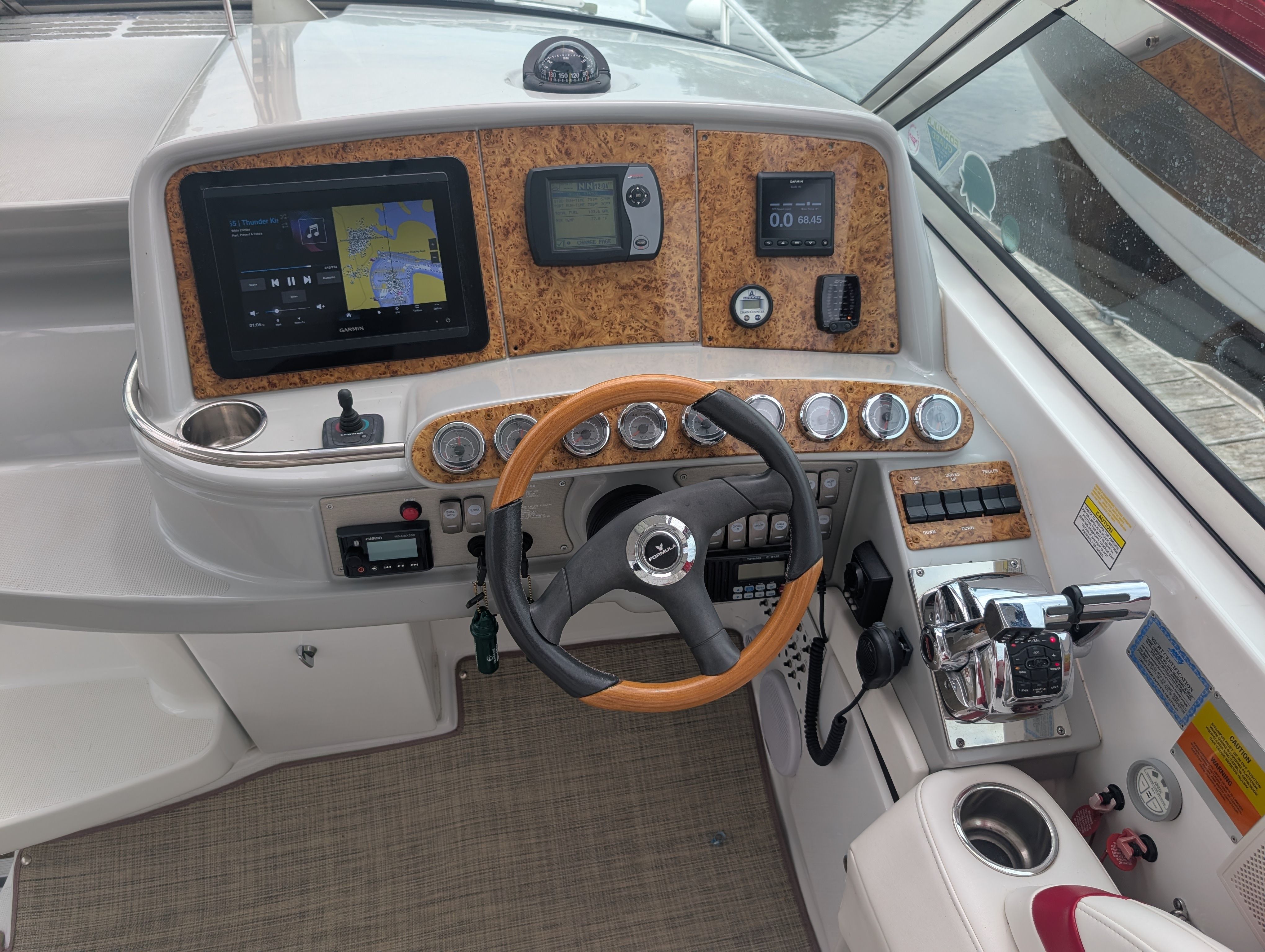 The cockpit of a 2007 Formula 400 Super Sport with wood paneling and modern instruments.