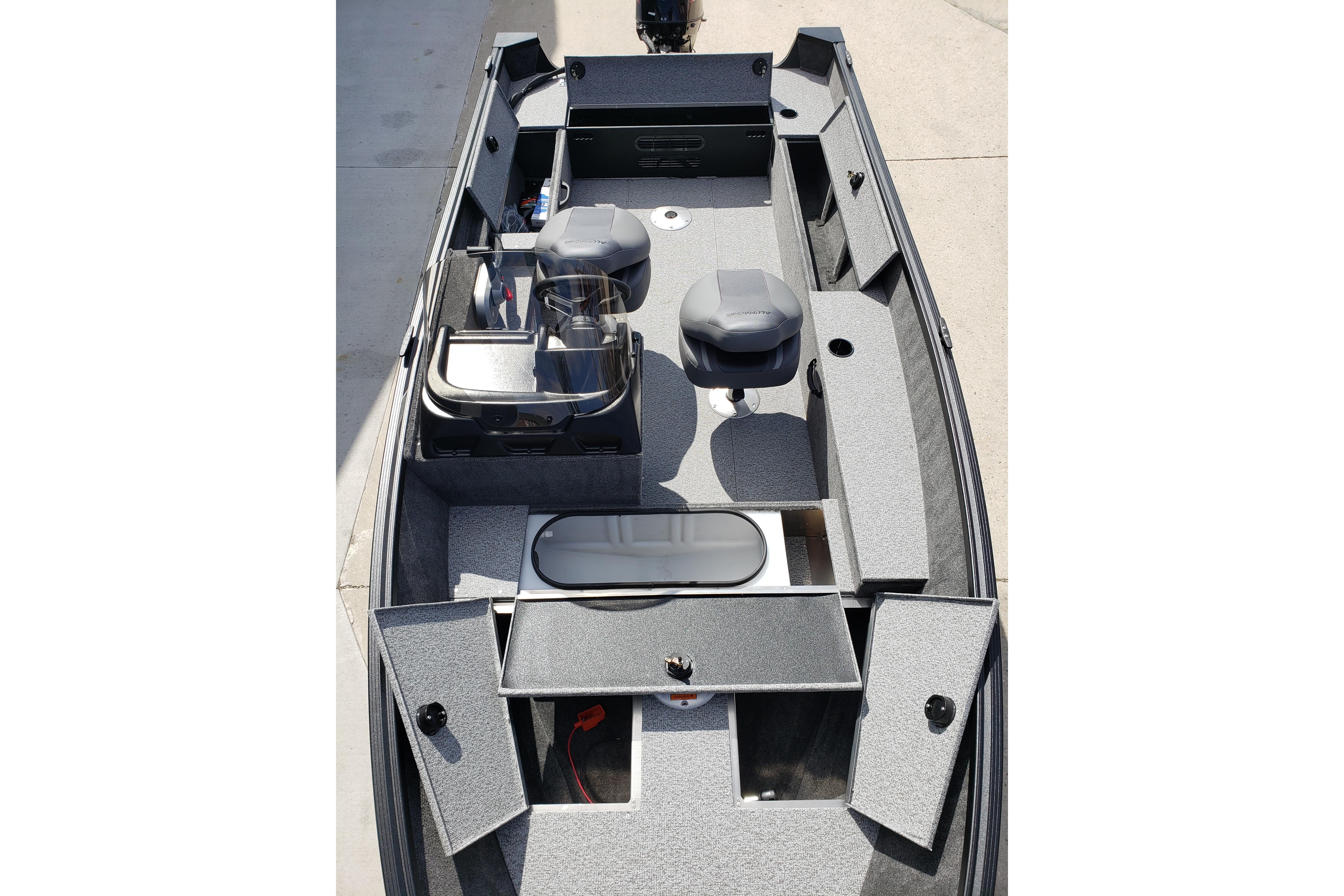 2026 Alumacraft Escape 165 CS boat interior with seating and storage compartments.