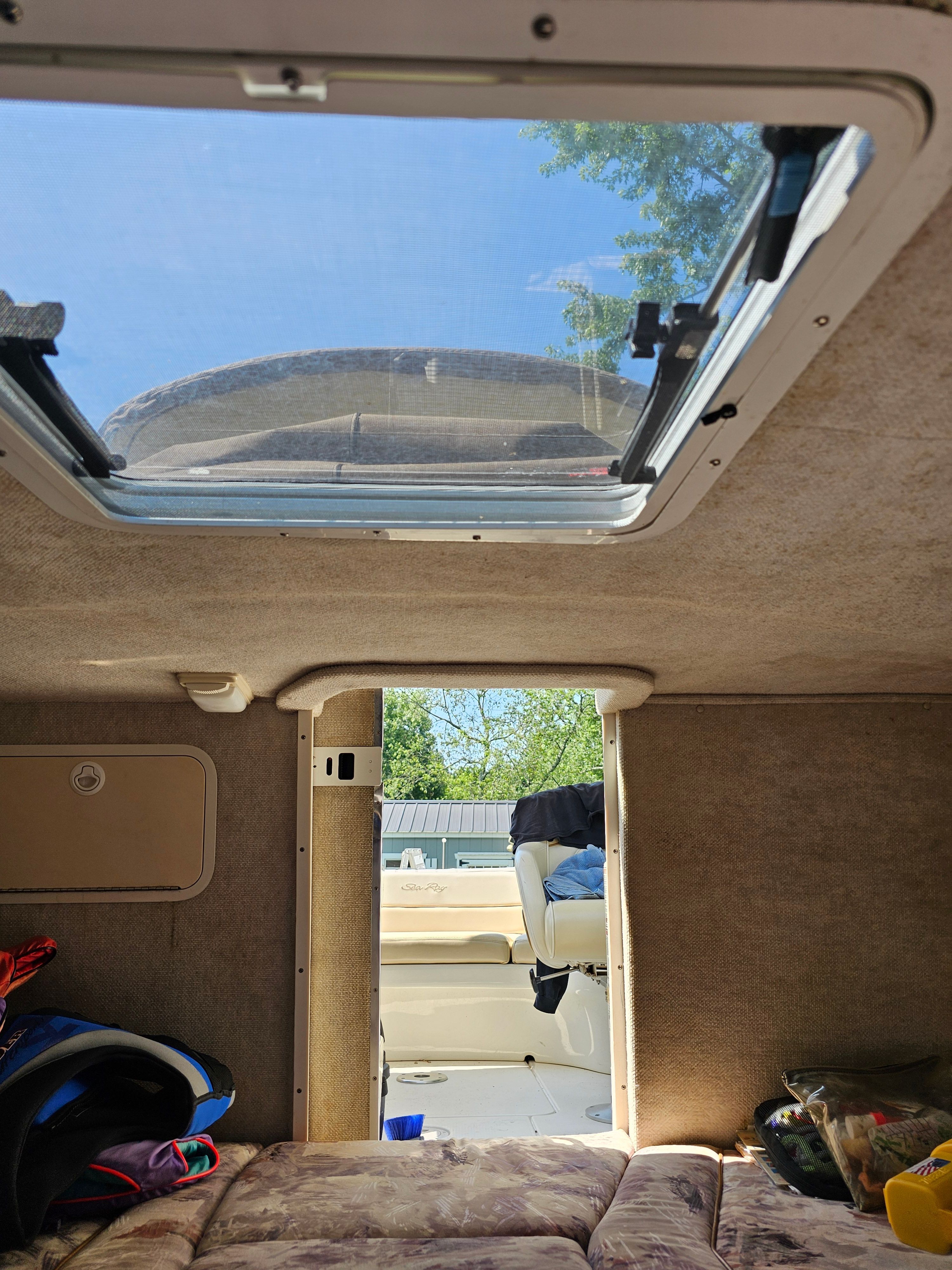 Interior of a Sea Ray 230 Overnighter with a view towards the cockpit.