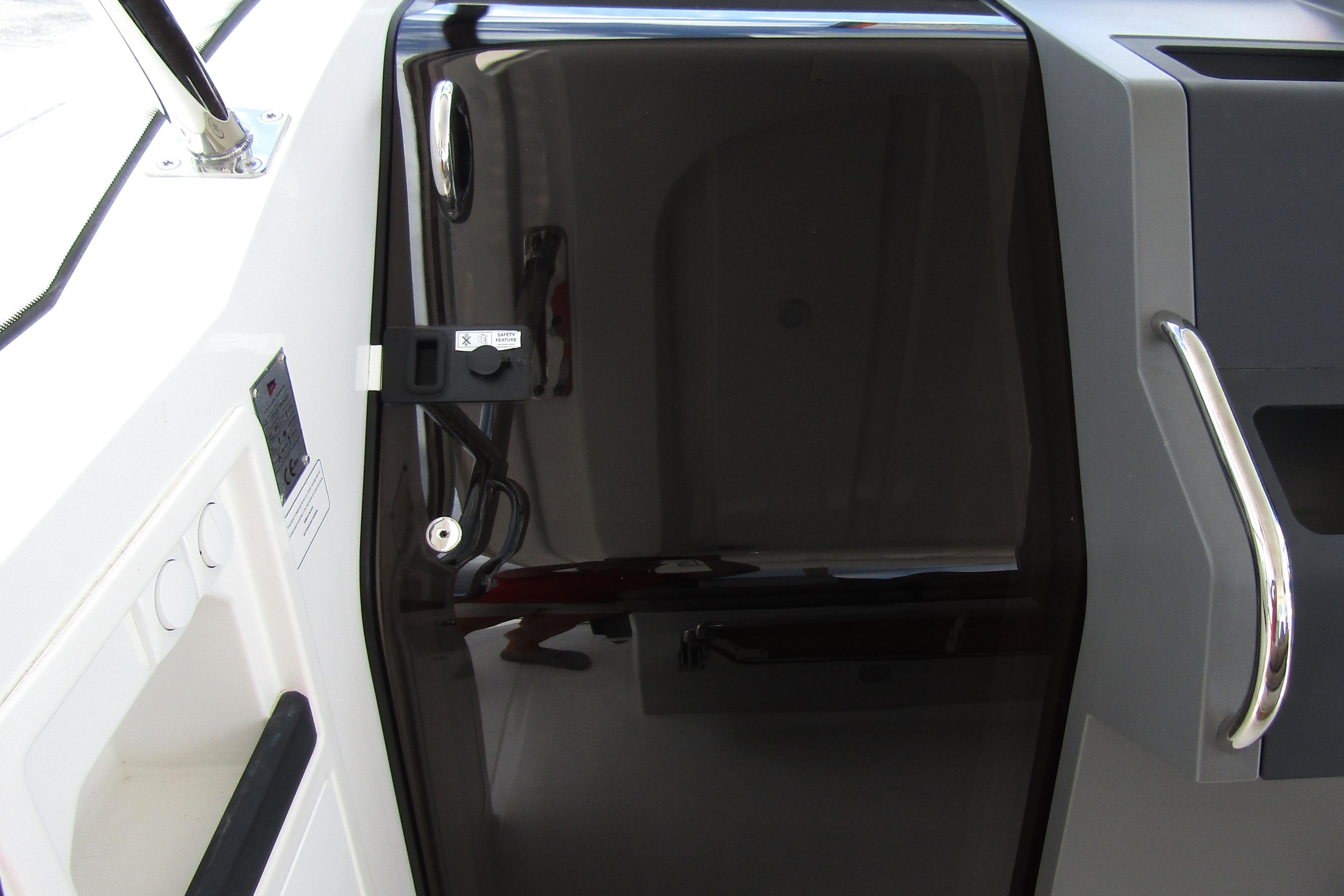 2025 Nimbus Tender 11 boat interior with sleek black door and modern handle design.