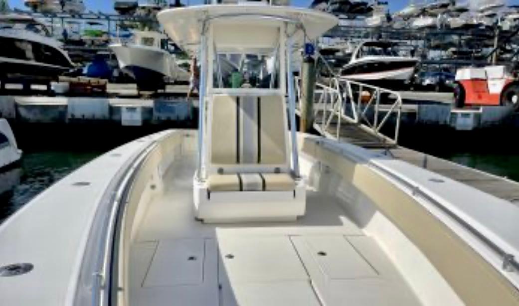 2008 Contender 36 Open boat docked at marina, showcasing spacious deck and seating.