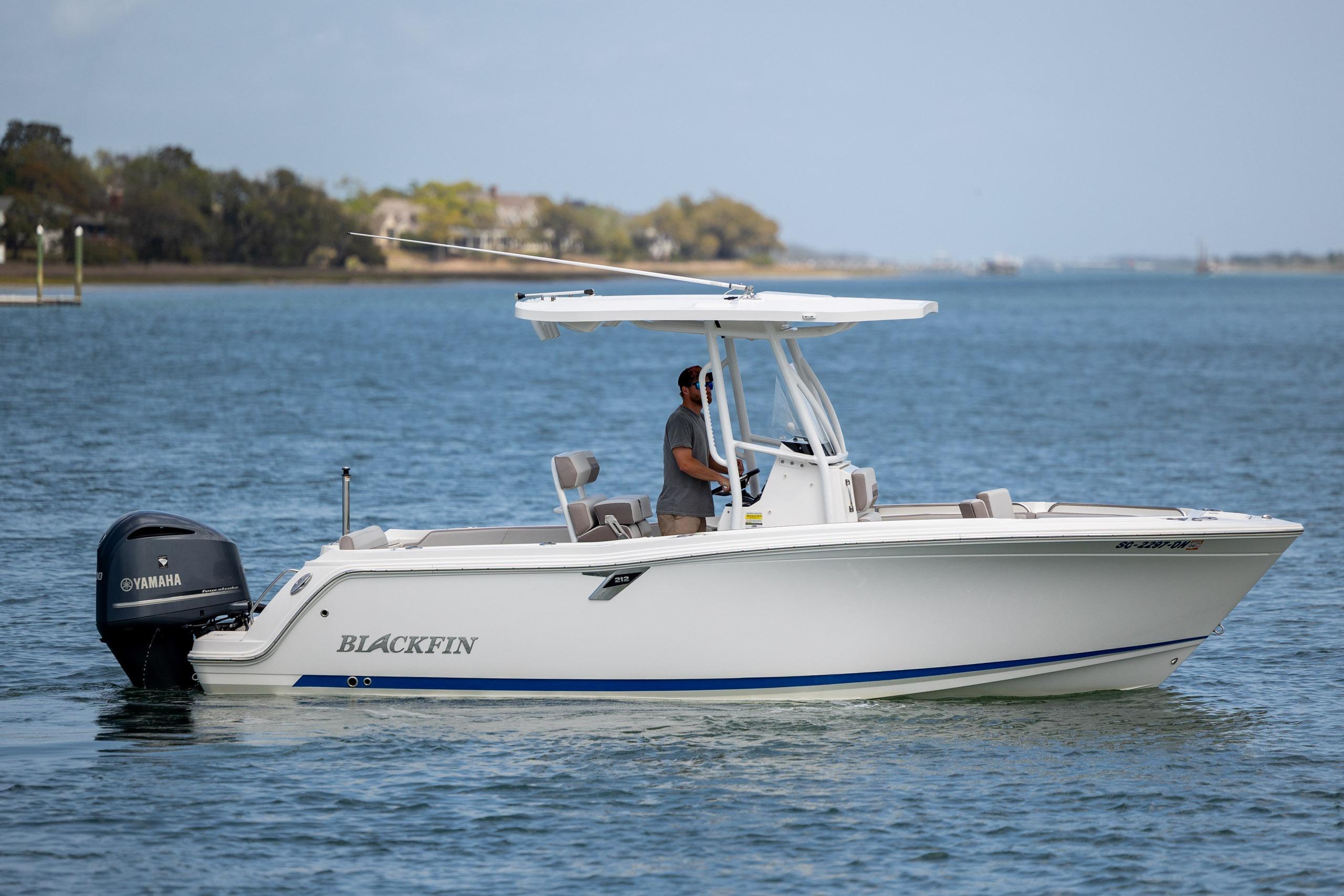 2019 Blackfin 212 CC boat cruising on calm waters with Yamaha engine.