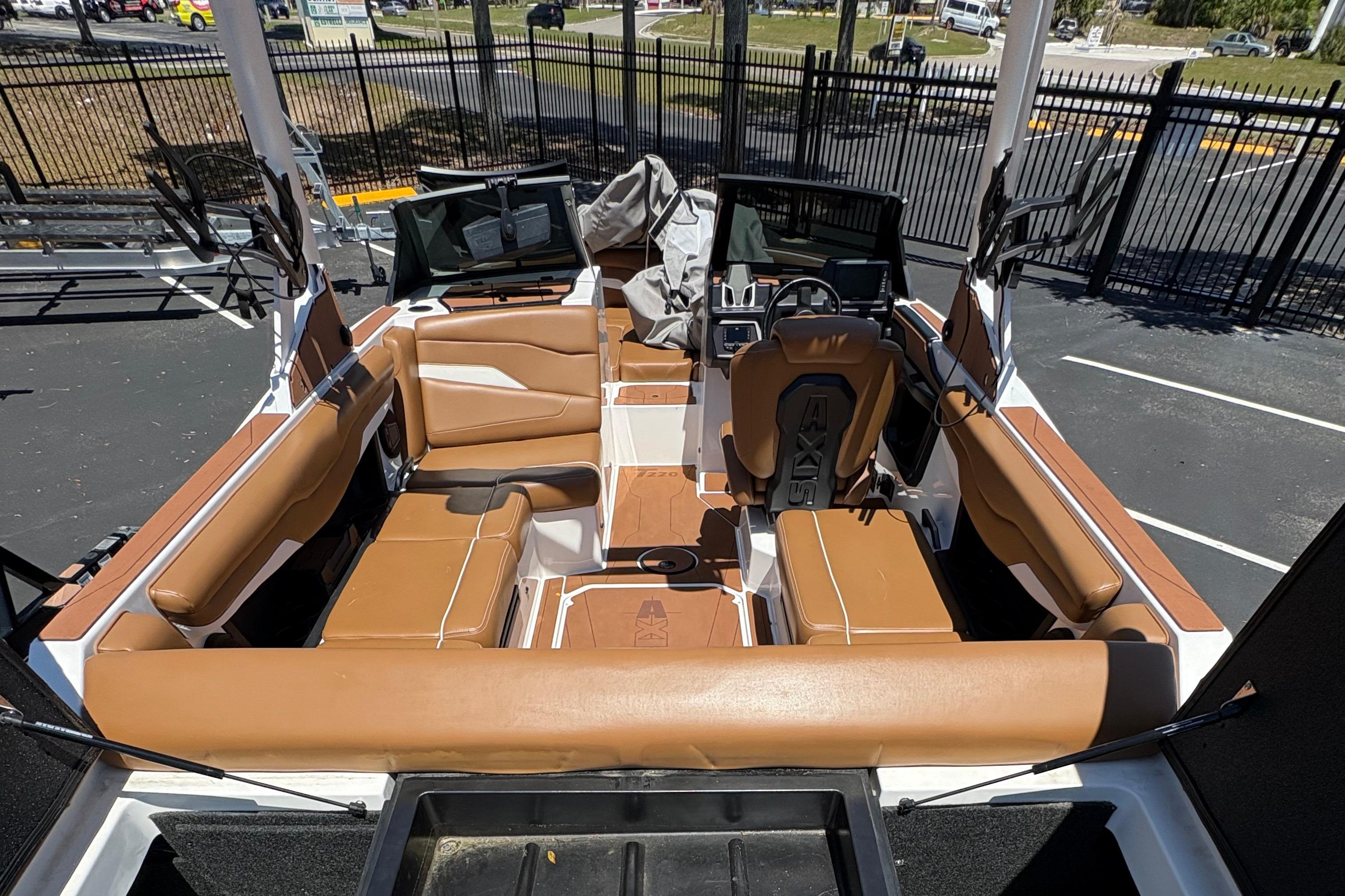 2025 Axis T220 boat interior with tan seating and modern dashboard design.