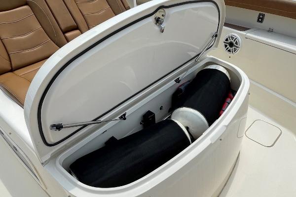 2020 Scout 420 LXF boat storage compartment with open lid, showcasing interior space.