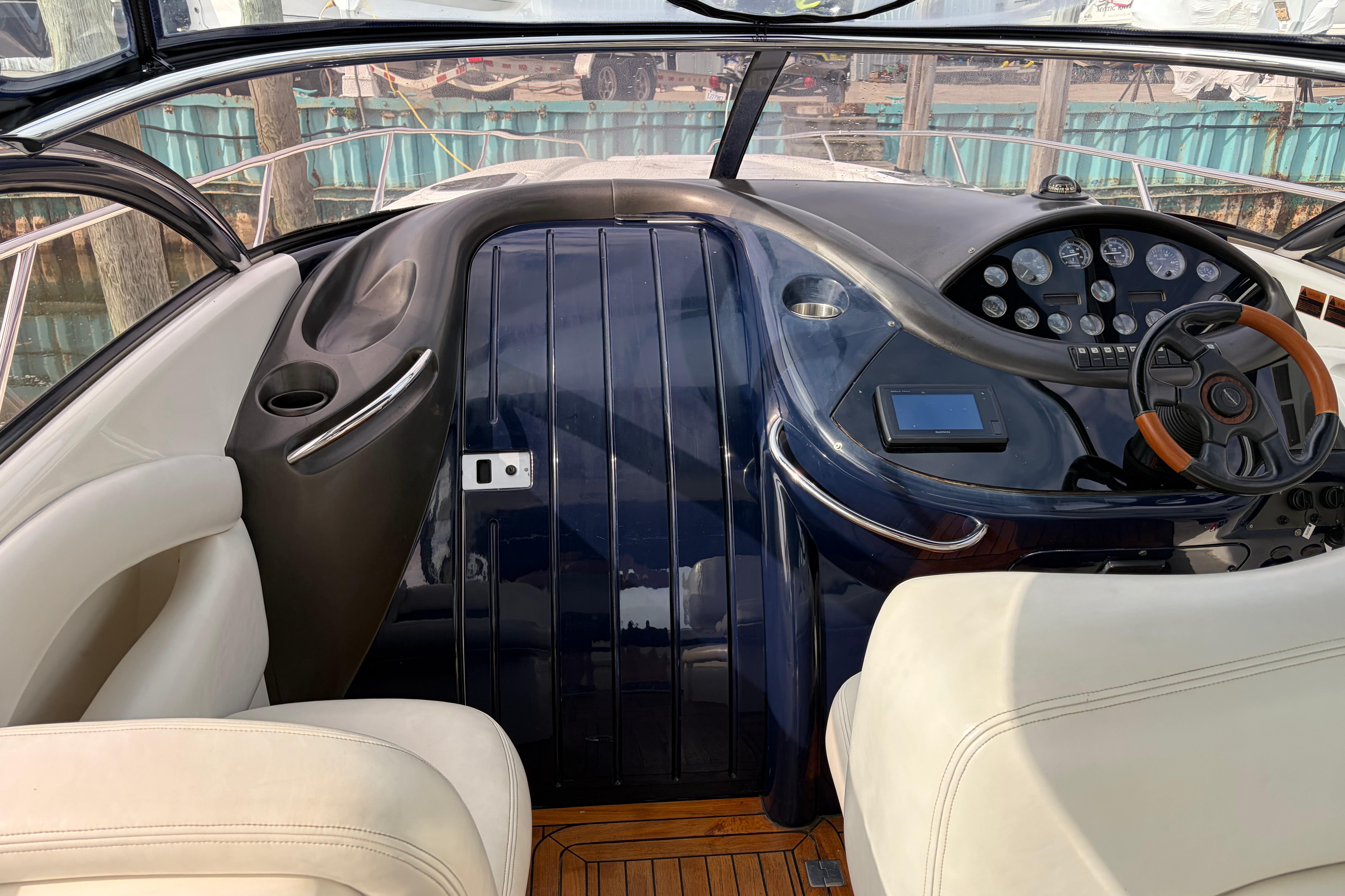 Cockpit of 2000 Sunseeker Superhawk 34 with steering wheel and instrument panel.