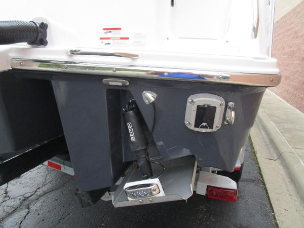Rear view of 2025 Solara S-250 CW boat, showcasing trim tabs and outboard motor mount.