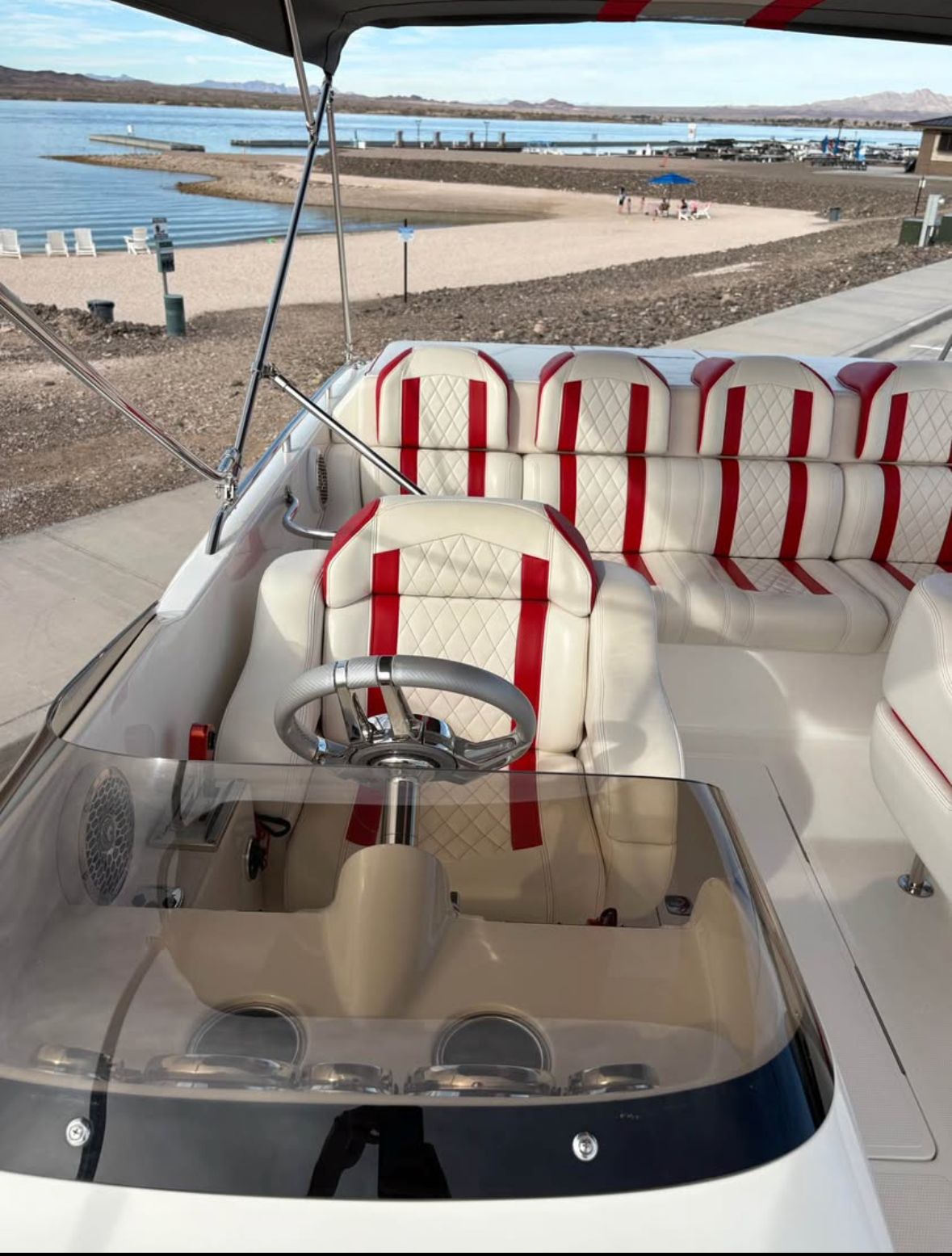 2022 Conquest 28’ Top Cat II Deck Boat with stylish interior by the beach.