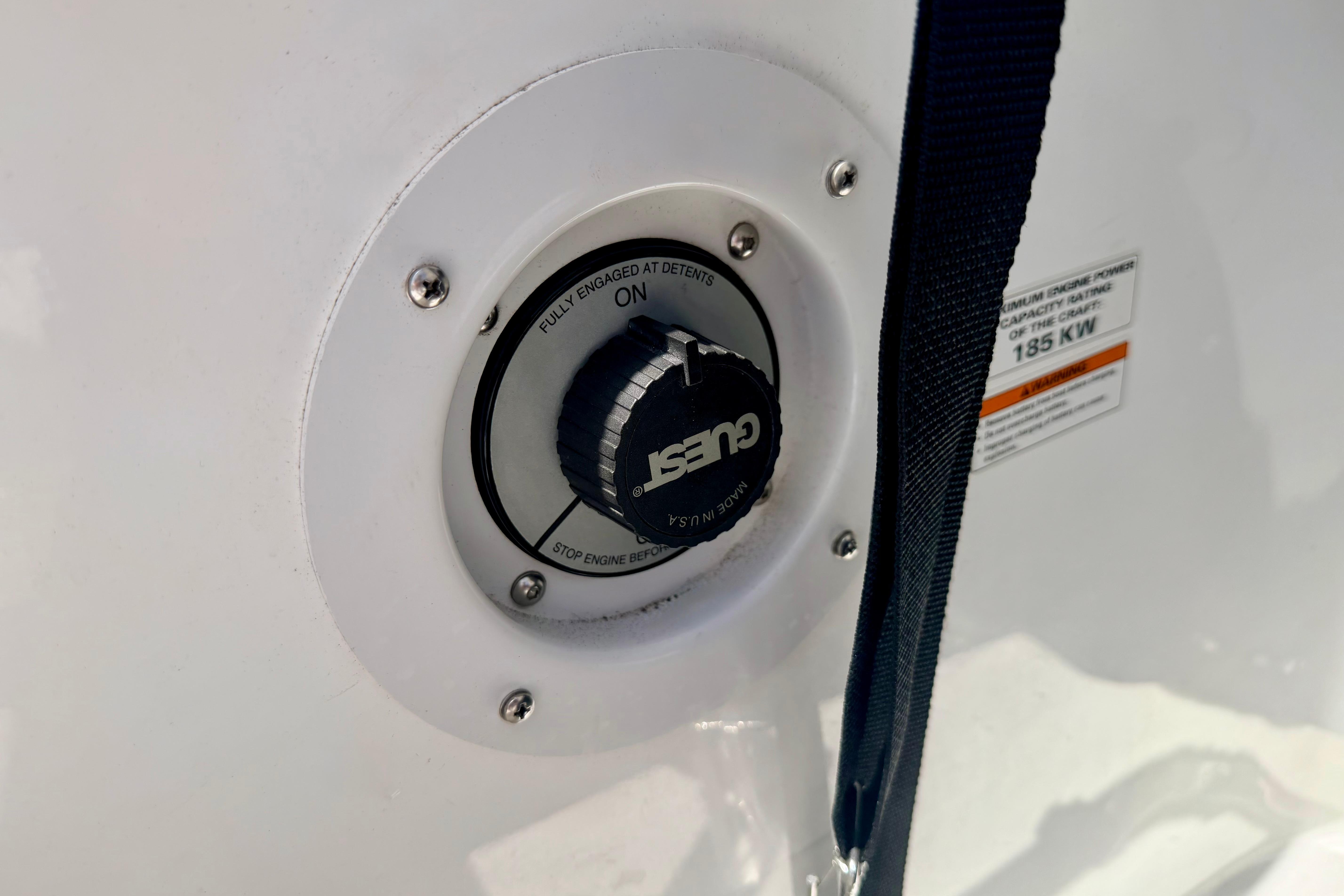 Close-up of a 2004 Bombardier SEADOO Utopia 185 fuel cap with safety strap.