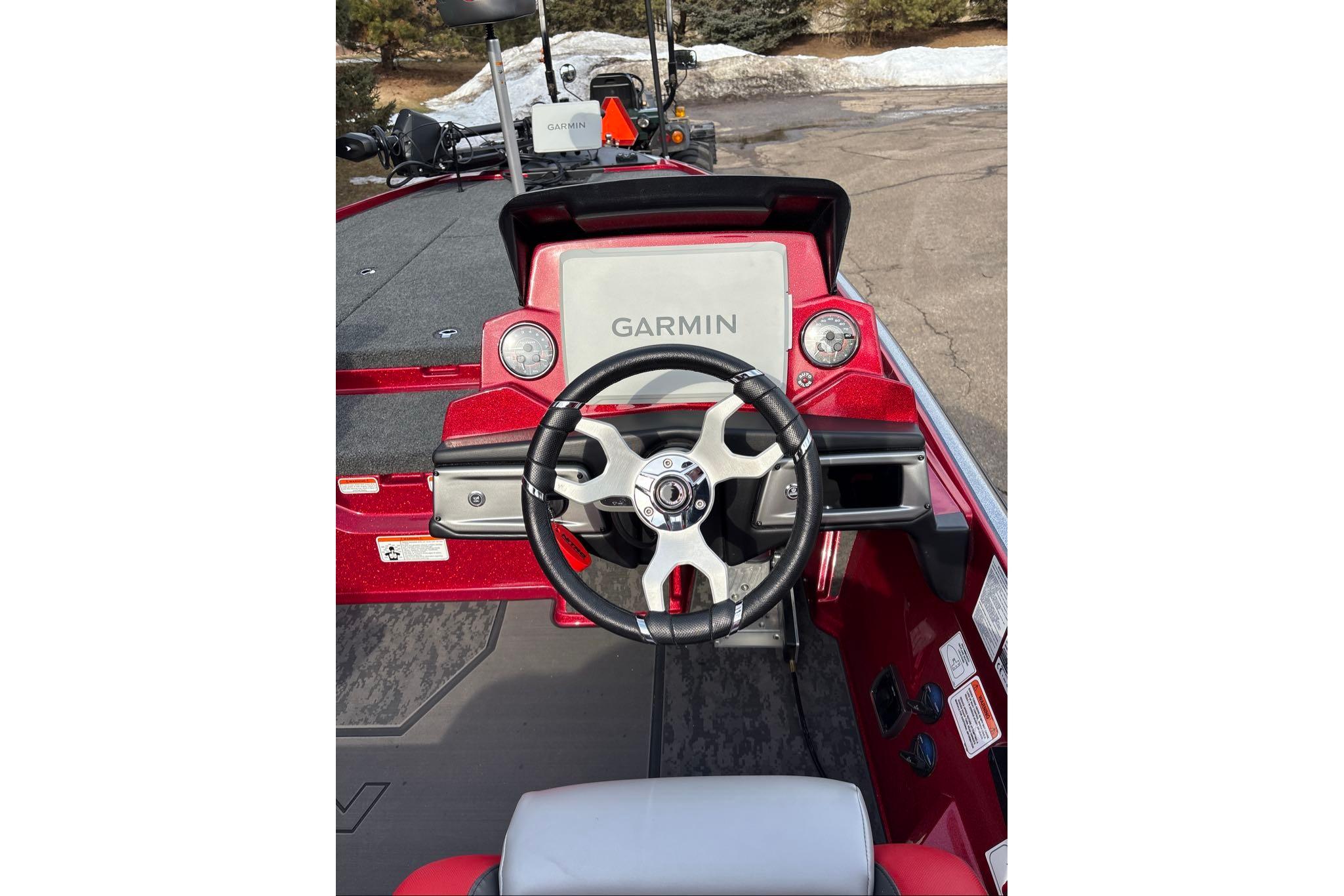 2026 Nitro Z20 XL Pro boat dashboard with Garmin navigation system and steering wheel.