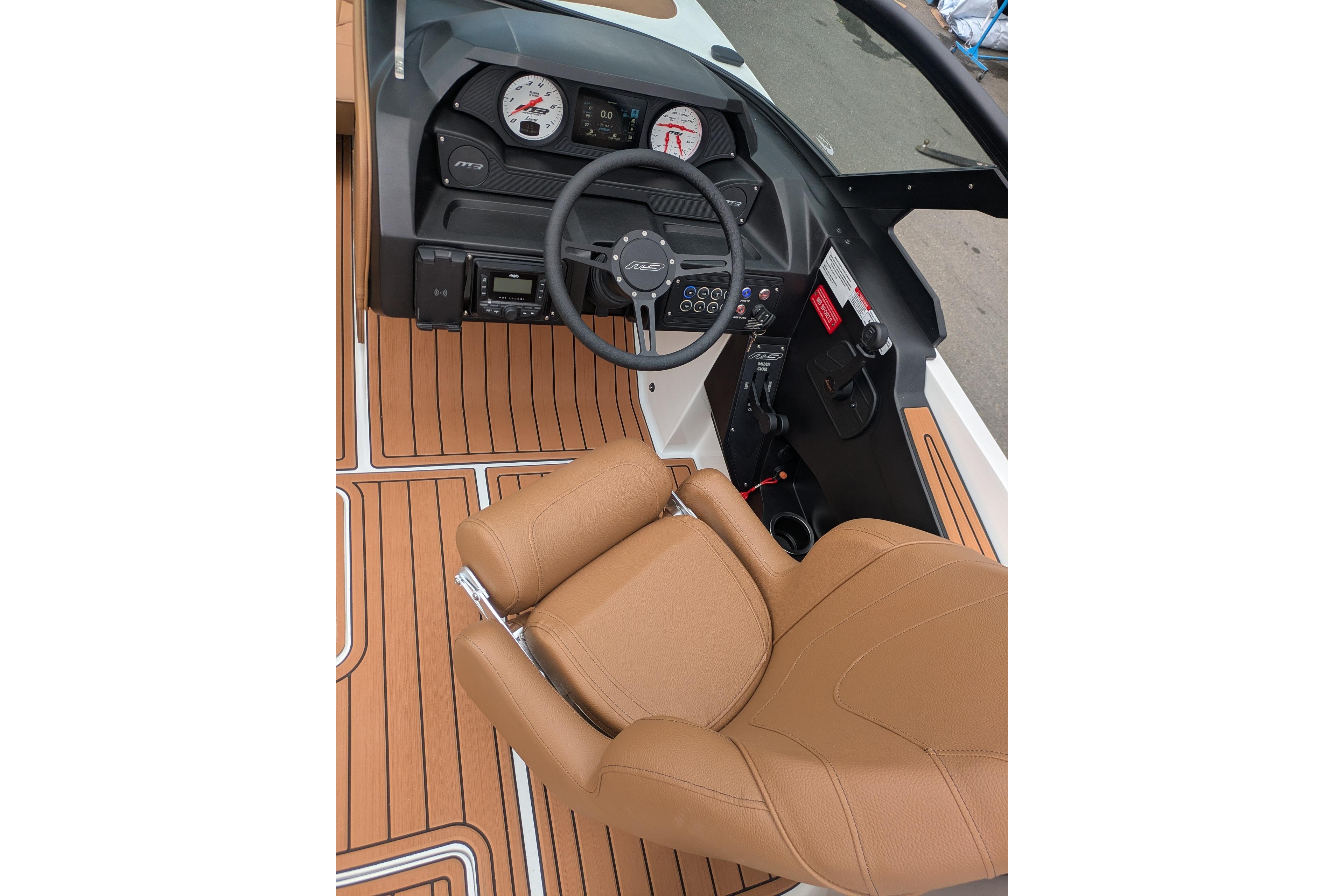 2026 MB B52-23 Classic LIMITED boat interior with tan seating and modern dashboard.