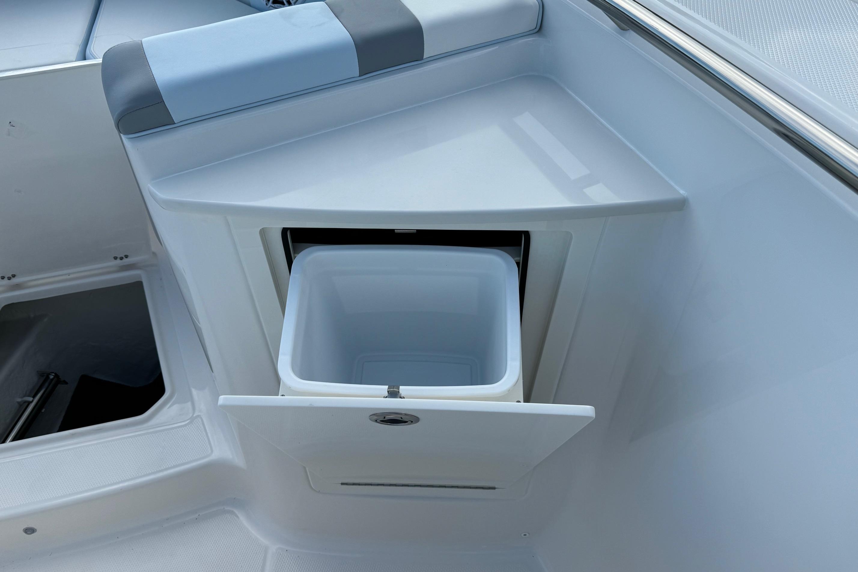 2025 Robalo R360 Center Console boat with built-in storage compartment.