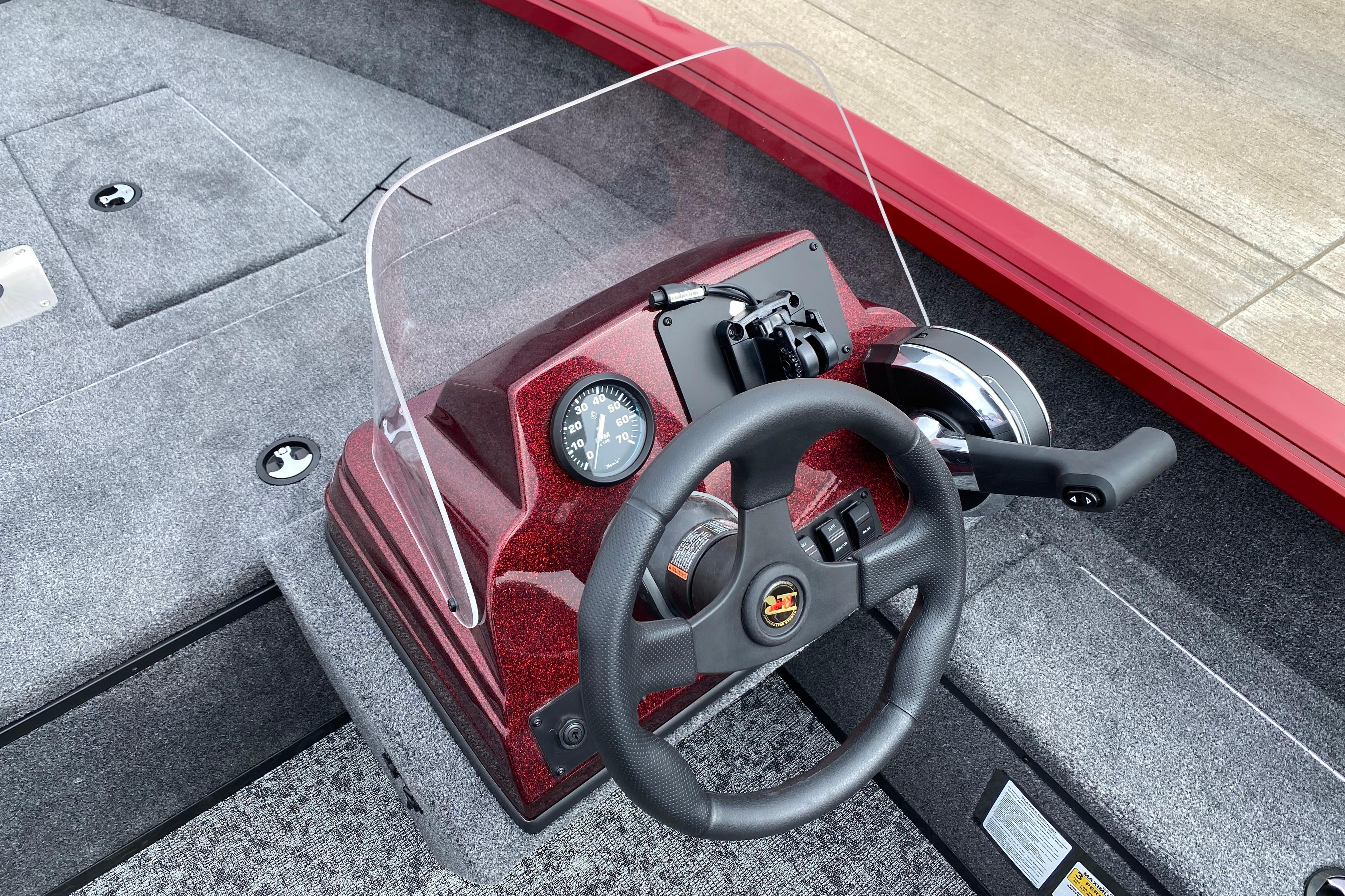 2026 Ranger VS1665SC boat dashboard with steering wheel and controls, featuring a sleek design.