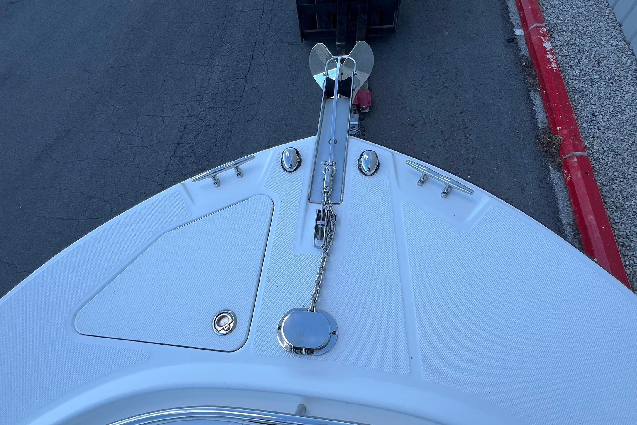 Bow view of 2006 Edgewater 245CC boat with anchor and chain.