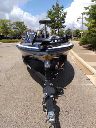 2025 Nitro Z19 boat on trailer in parking lot, sunny day.