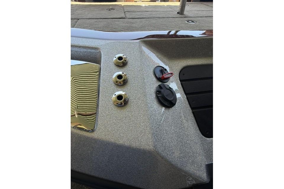 Control panel of 2026 Ranger Z521R Cup-Equipped boat with metallic finish and switches.