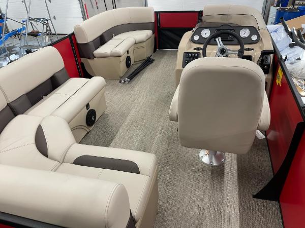 2025 Bentley Pontoons 200 Fish-N-Cruise interior with beige seating and modern dashboard.