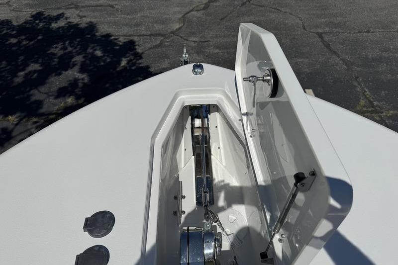 2026 Sea Hunt Gamefish 30 Forward Seating boat anchor compartment, open lid view.