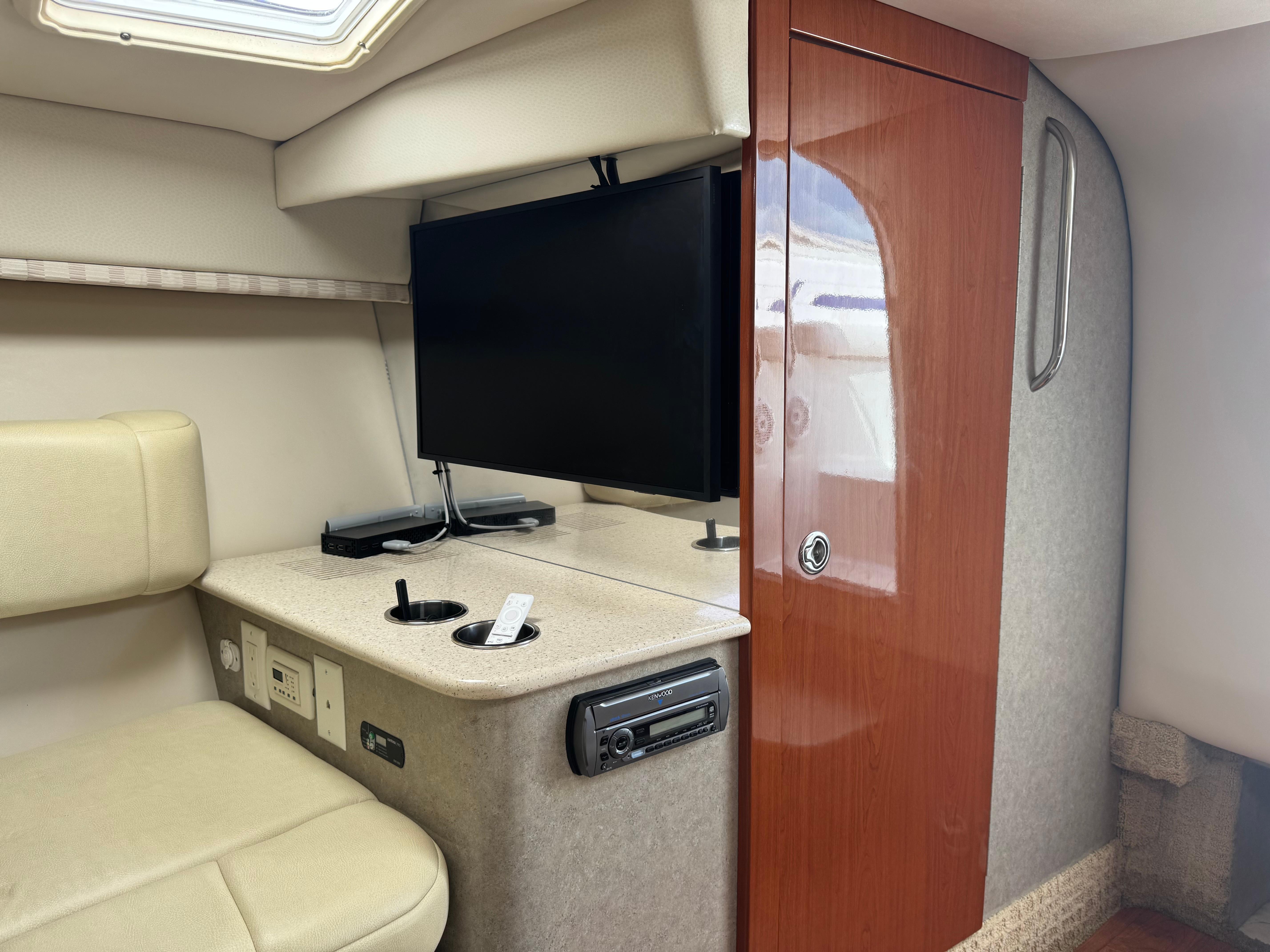 Interior of 2007 Formula 330 Sun Sport boat with TV and seating area.