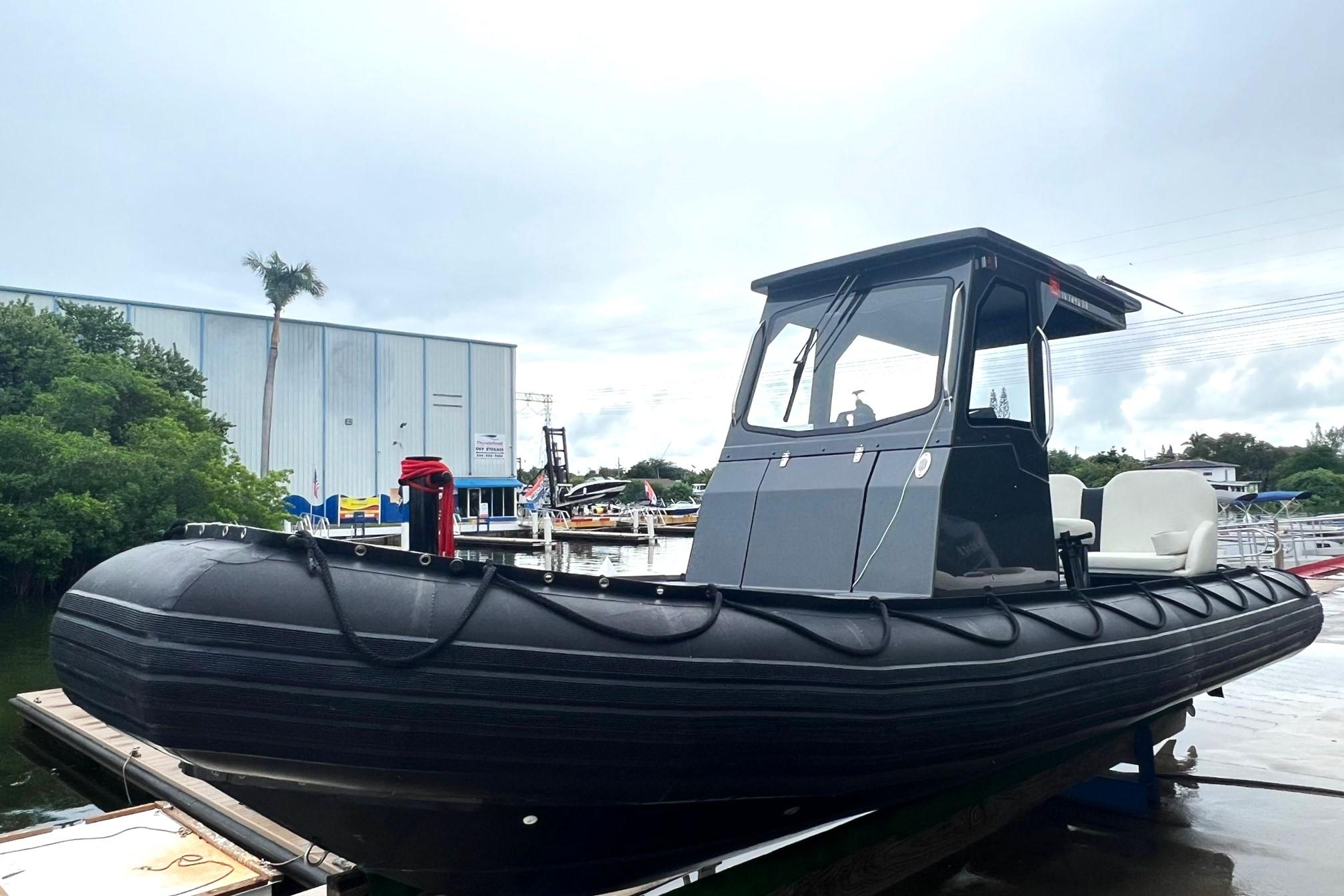 2014 Zodiac Milpro Hurricane Custom boat docked at a marina.