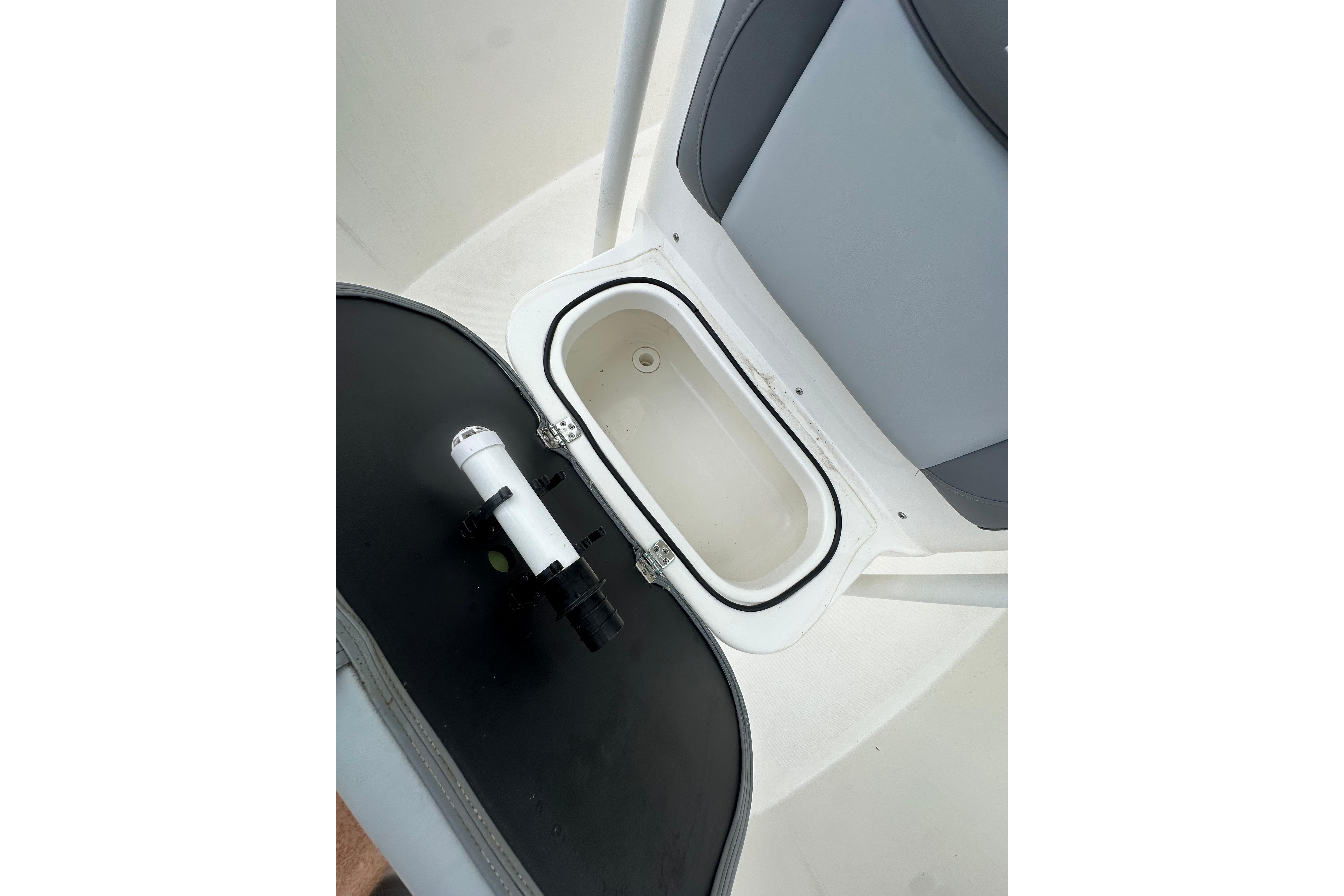 2023 NauticStar 2102 Legacy boat interior with open storage compartment.