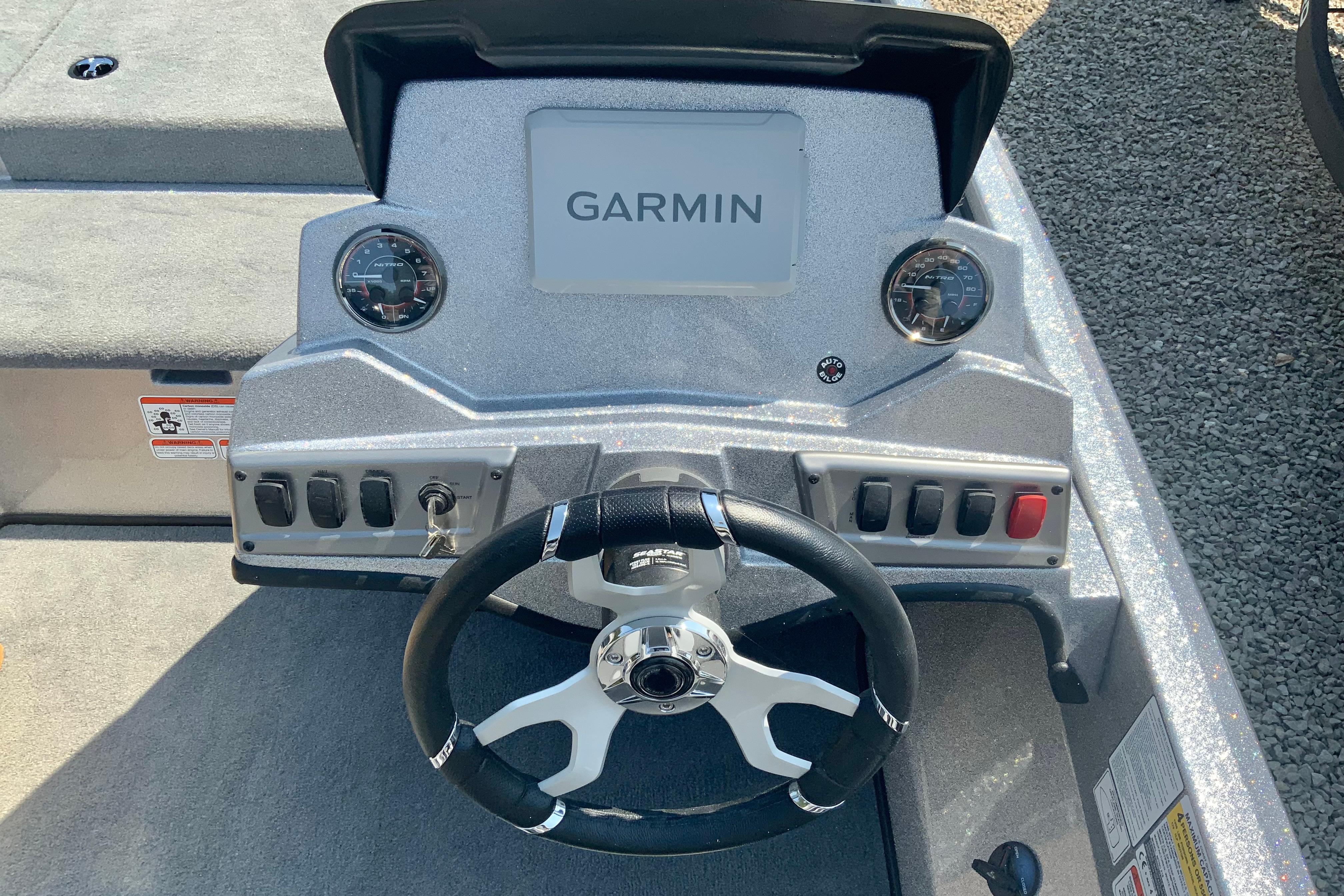 Steering console of 2026 Nitro Z18 Pro boat with Garmin display and gauges.