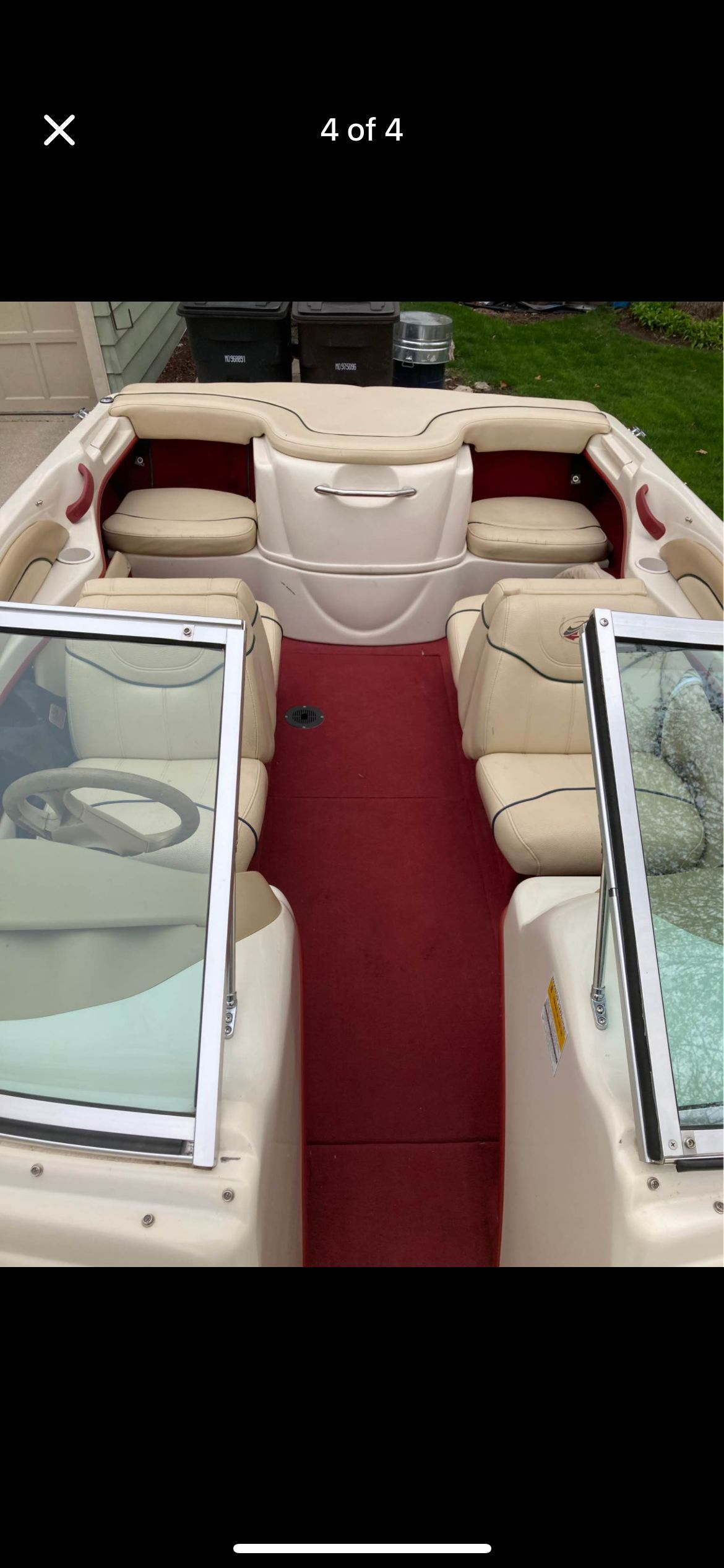 Interior of a 1999 Sea Ray 180 boat with red and beige seating.