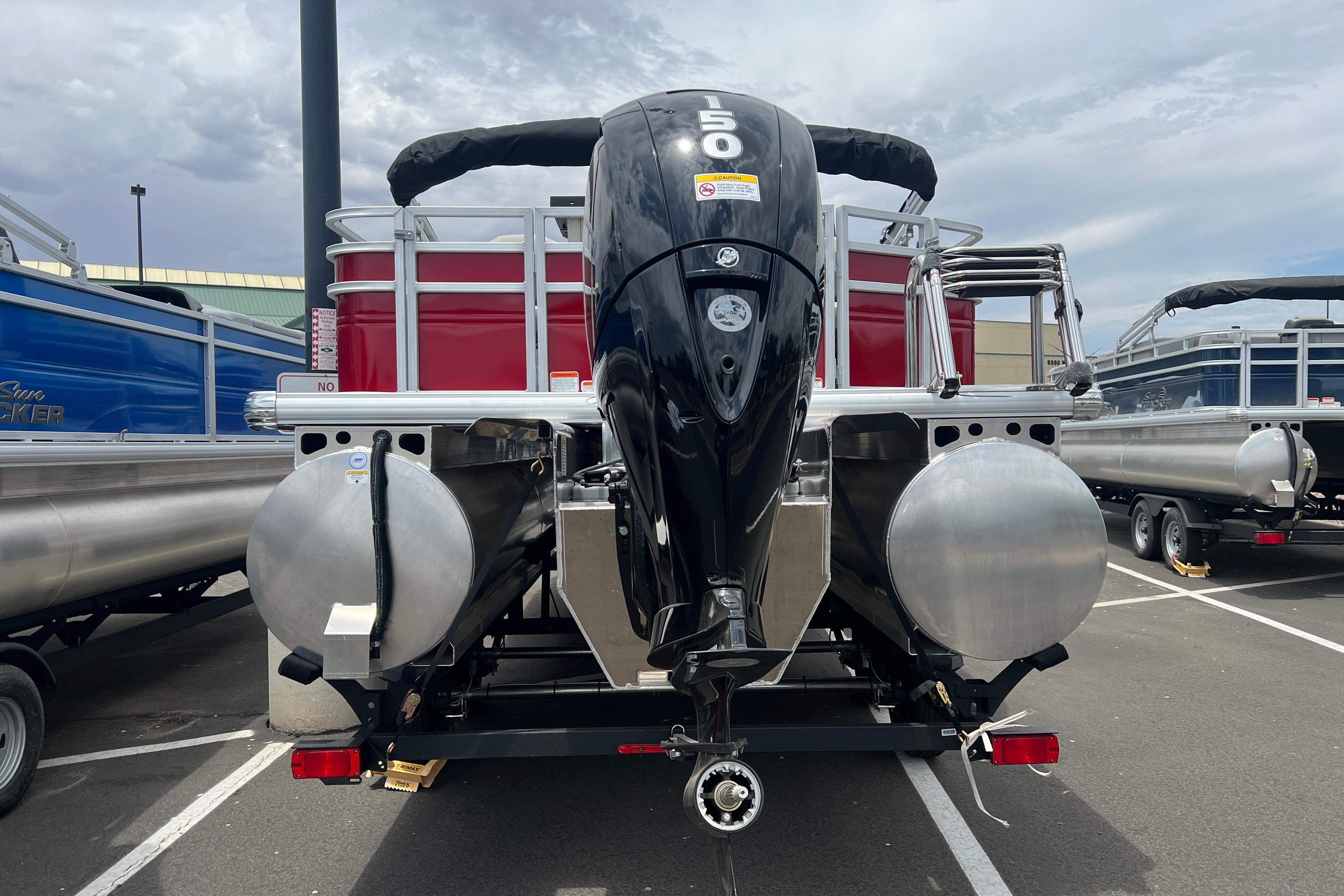 2026 Sun Tracker Fishin' Barge 22 XP3 pontoon boat with powerful outboard motor.