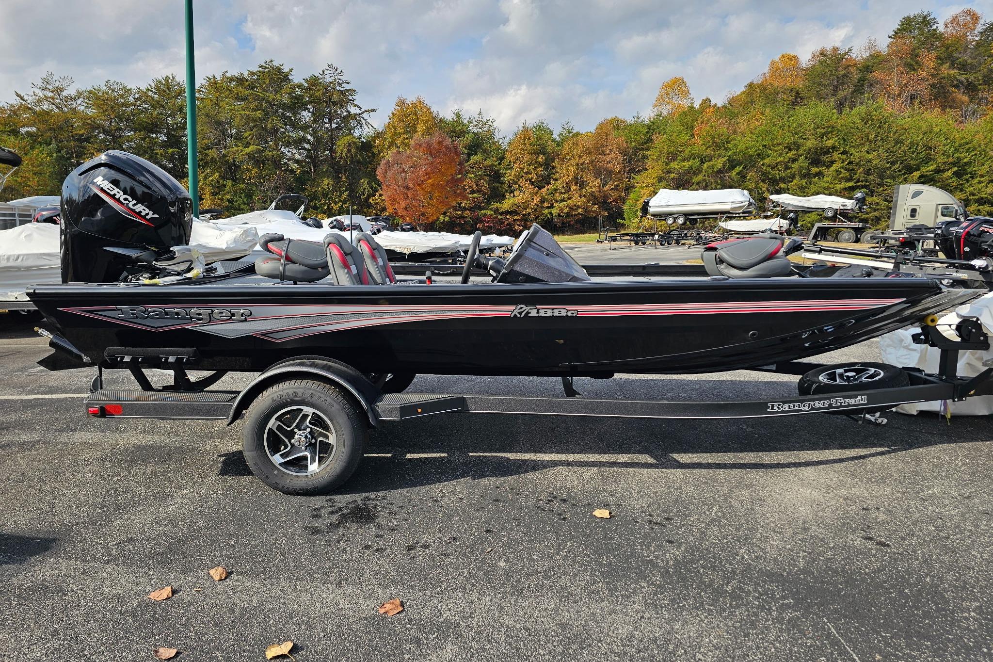 2026 Ranger RT188C boat on trailer, parked outdoors with autumn trees in background.