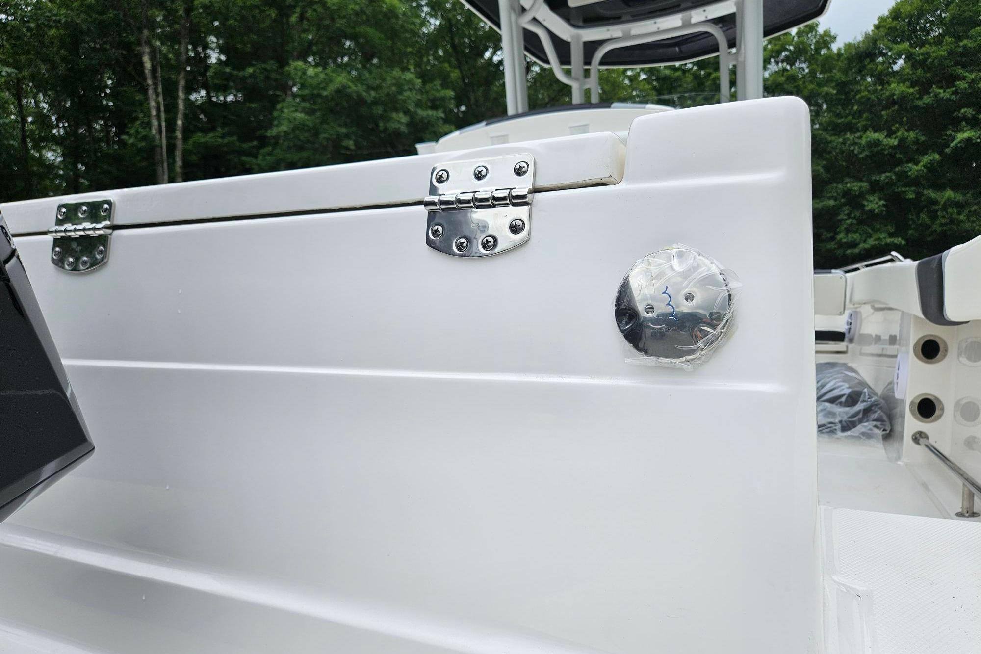2025 Robalo R230 Center Console boat detail with stainless steel hinges and fittings.