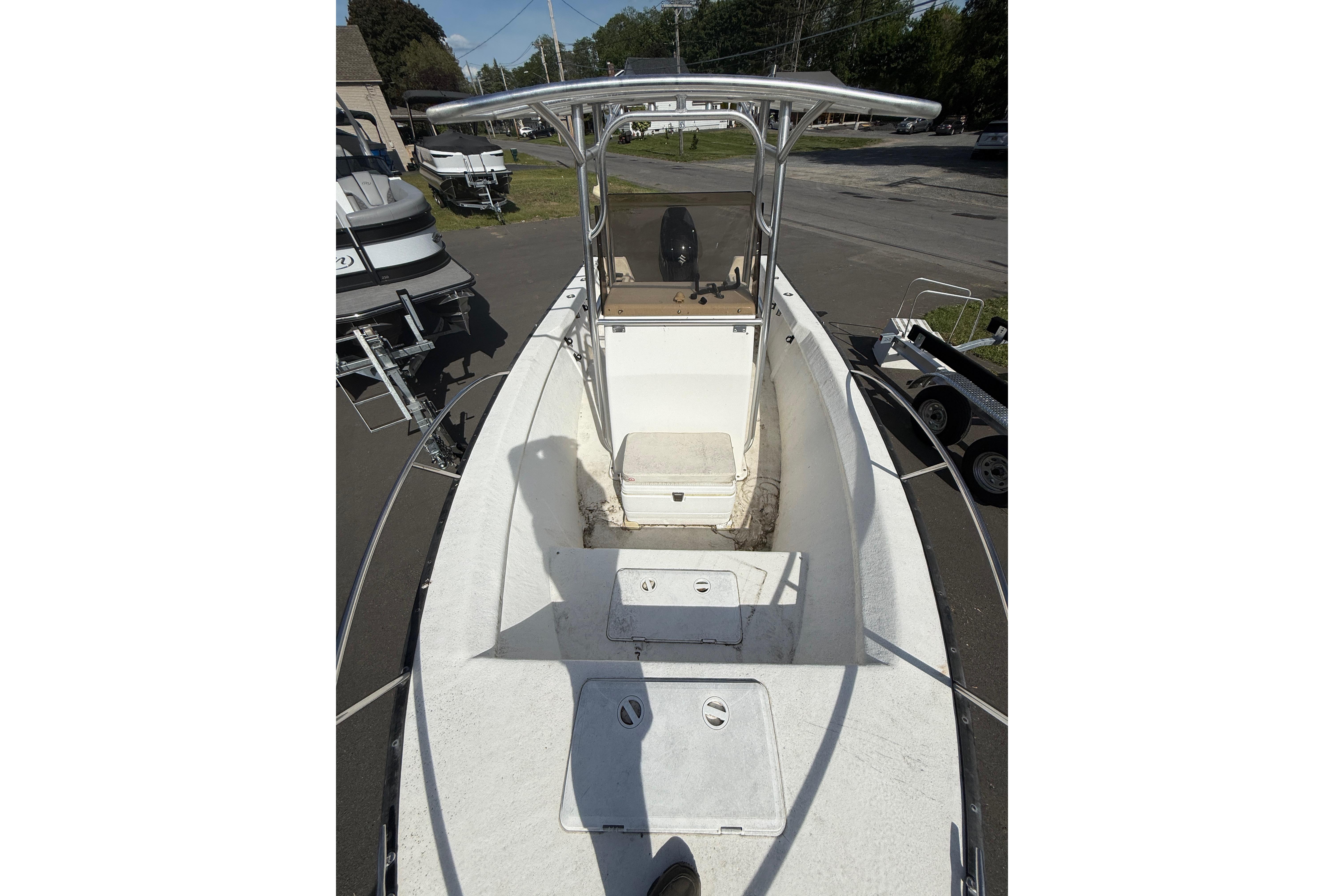 2008 Key Largo 206 Center Console boat, white deck, parked outdoors.