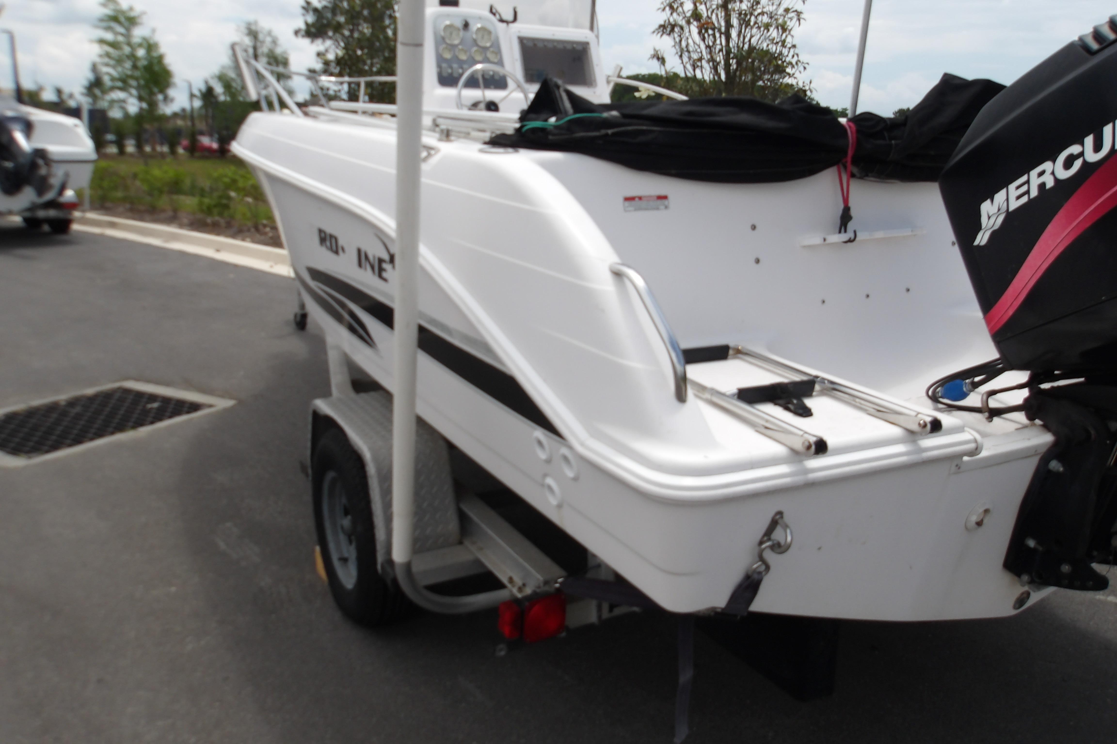2000 Pro-Line 19 Sport boat on trailer with Mercury outboard motor.