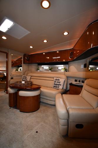 Luxurious interior of a 2003 Sea Ray 460 Sundancer yacht with plush seating and elegant design.