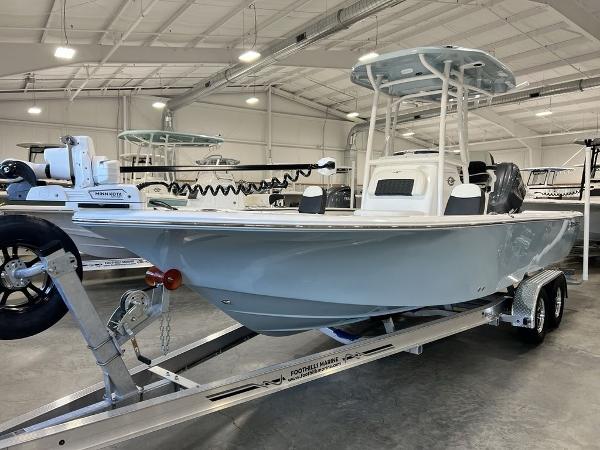 2025 Tidewater 2300 Carolina Bay boat on trailer in showroom.