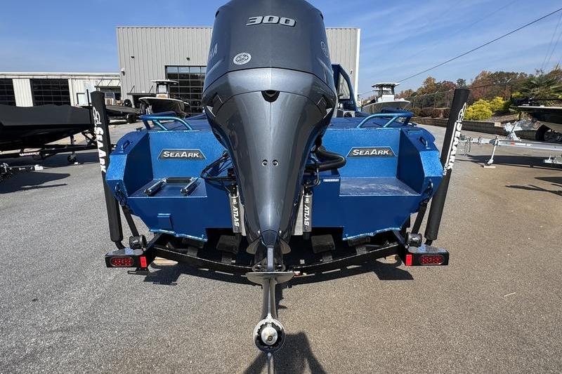 2026 SeaArk Dynasty 2.0 boat with powerful 300 horsepower engine, parked outdoors.